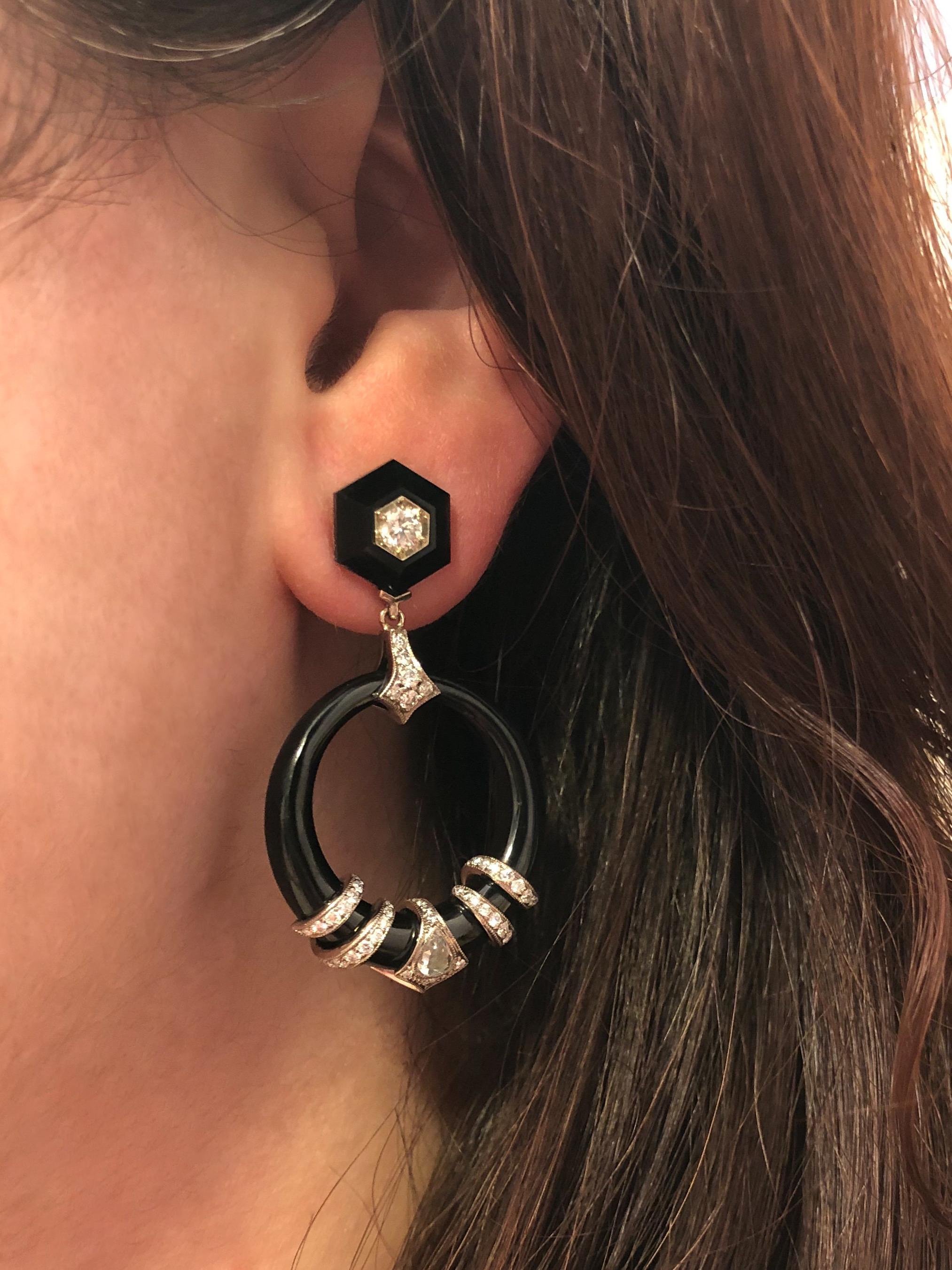 Fred Leighton Black Jade and Diamond Coil Doorknocker Earrings

Coil motifs set with pear shape rose cut diamonds totaling approximately 0.24 carat accented with round diamonds totaling approximately 1.20 carats encircle black jade discs suspended