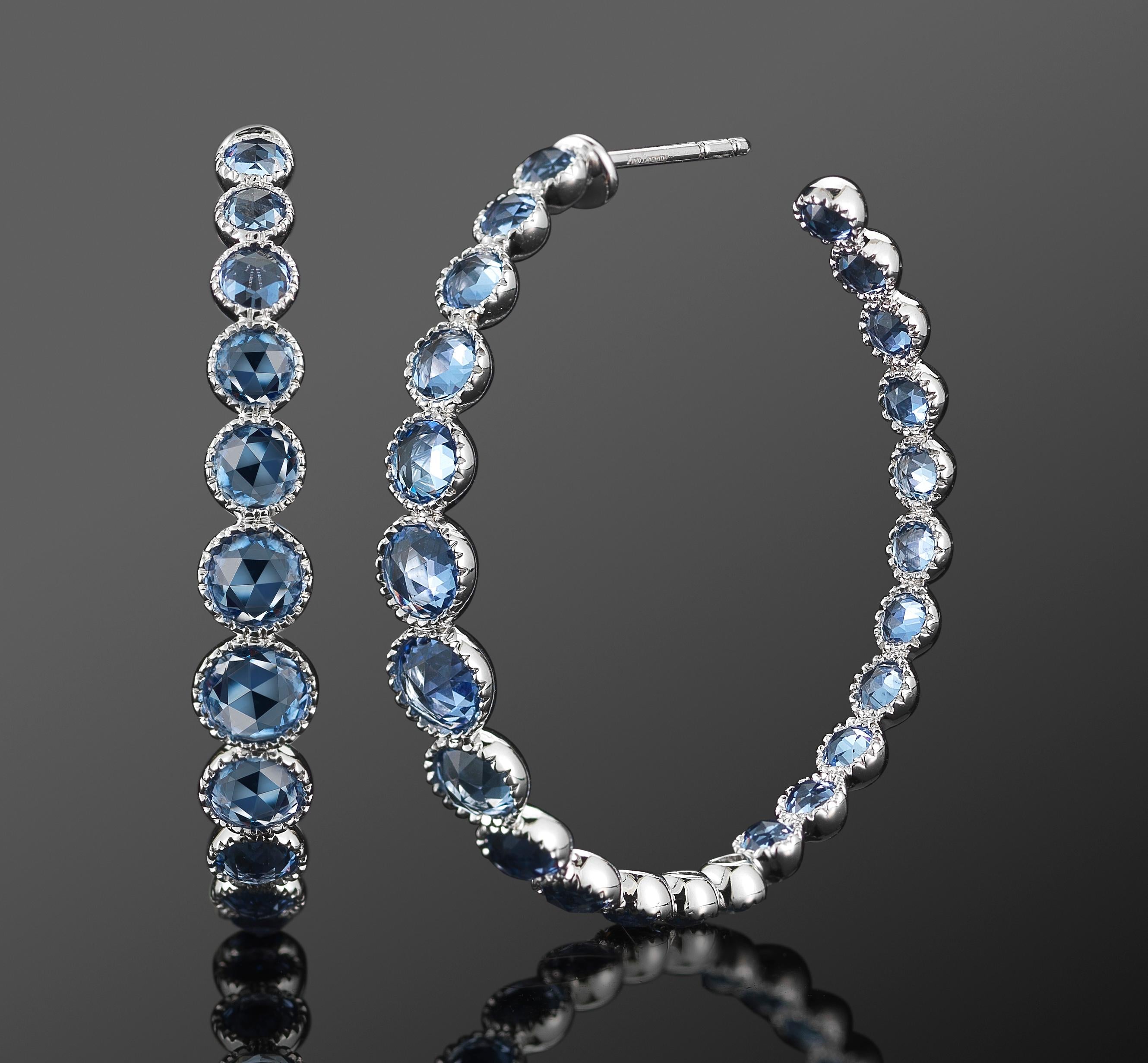 Graduating hoops of round rose cut sapphires totaling approximately 6.79 carats are mounted in 18 karat white gold.

Fred Leighton is renowned for extraordinary collections of vintage and contemporary jewelry. New signature creations combine the