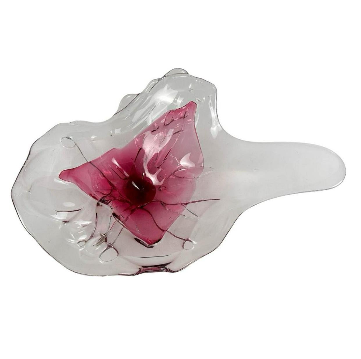 Studio artisan hand blown organic inspired biomorphic shaped centerpiece two color glass bowl. Modeled with an internally cased pink raspberry form encased within clear crystal. Signed with engraved artist name on the underside and dated 1960.