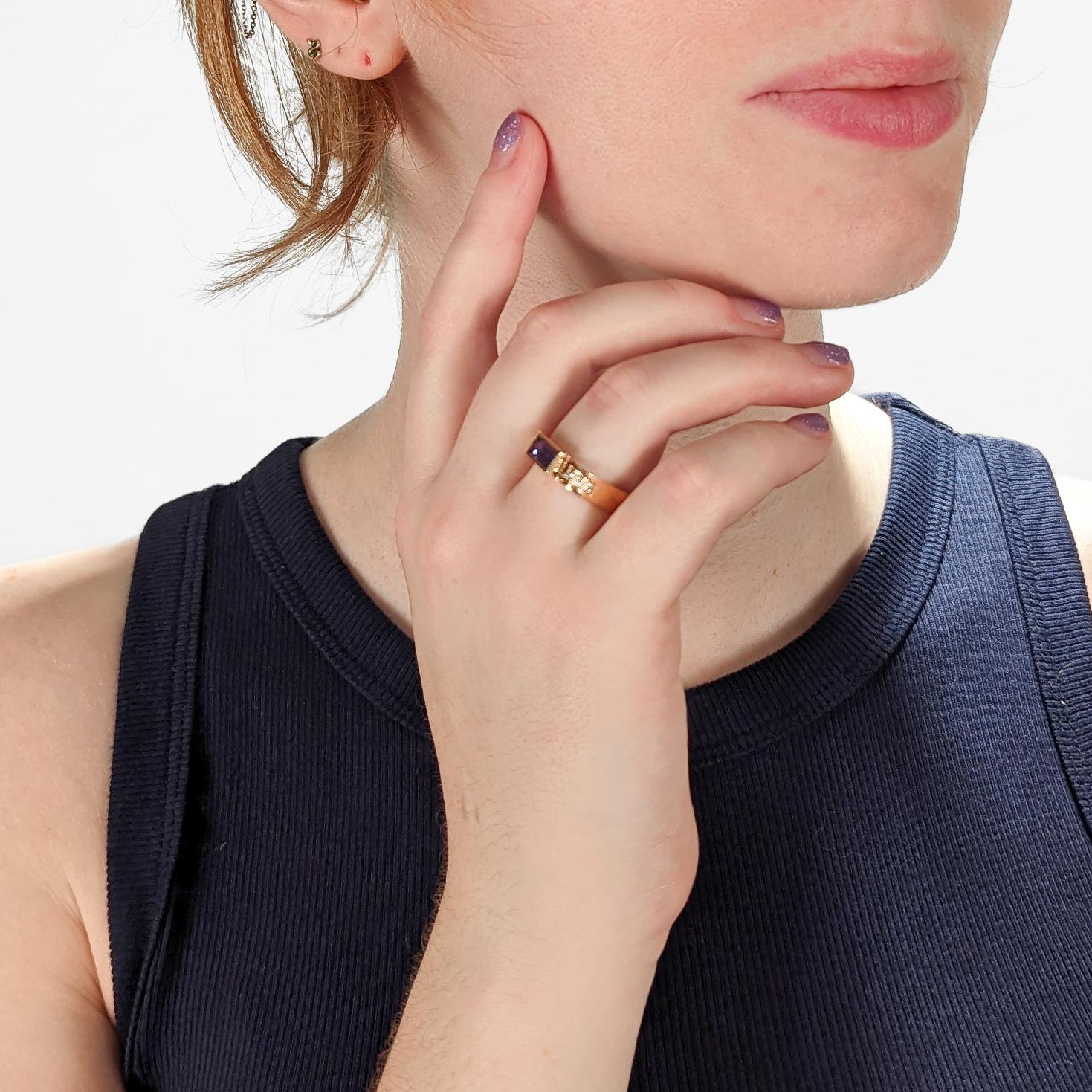 A very fine Gabriel Ofiesh ring.

With a baguette-cut tanzanite gemstone bezel set at the center and with white diamonds pave set to the shoulders of square-shaped 14k gold band. 

Simply a wonderful Ofiesh ring!

Date:
20th Century

Overall