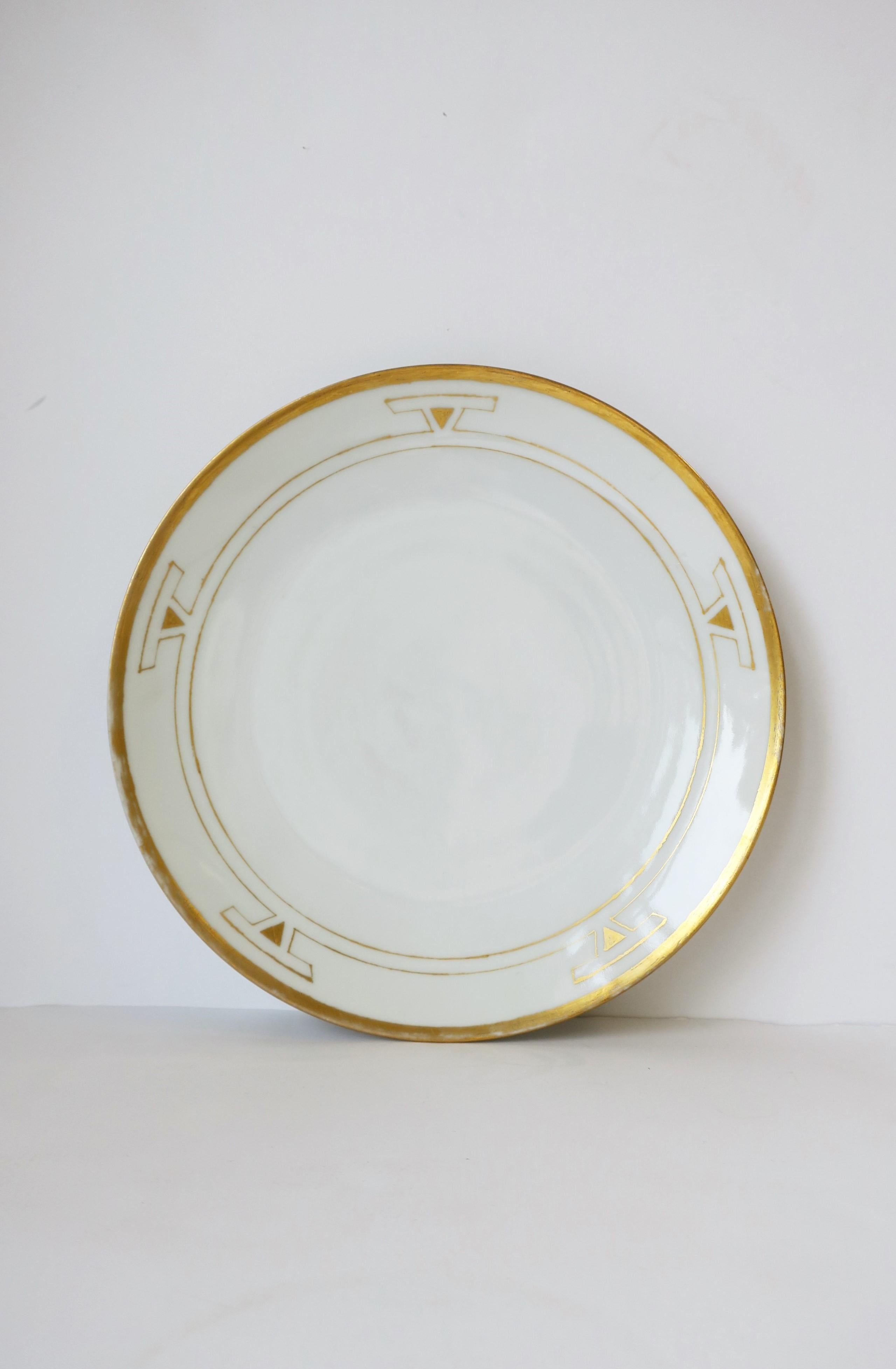 A beautiful German Art Deco period white and gold porcelain plate signed by artist for the Thomas Porcelain company, 1929, Germany. Dated by hand, 