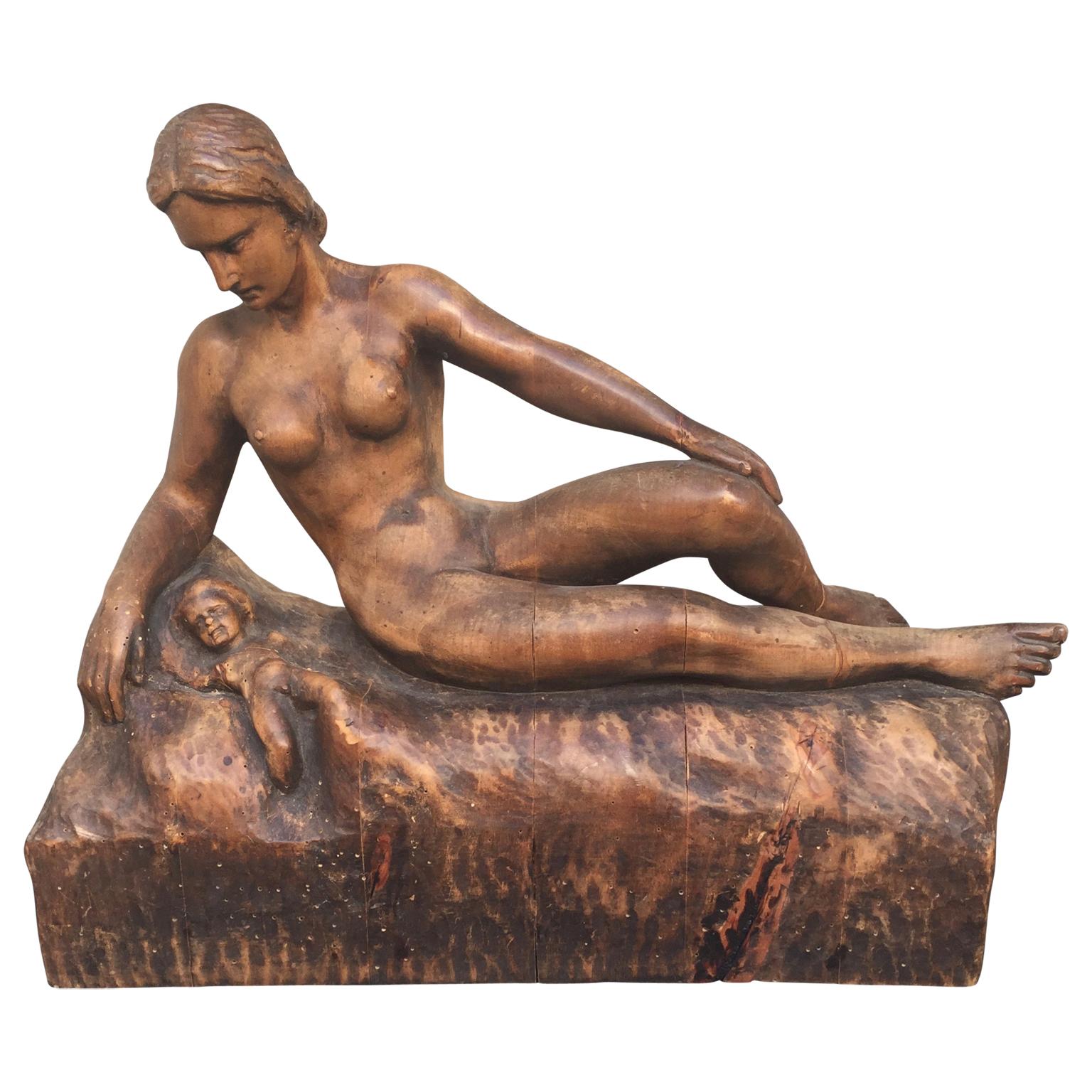 Artistically significant hand carved sculpture of nude mother and child, completed during the Second World War.
