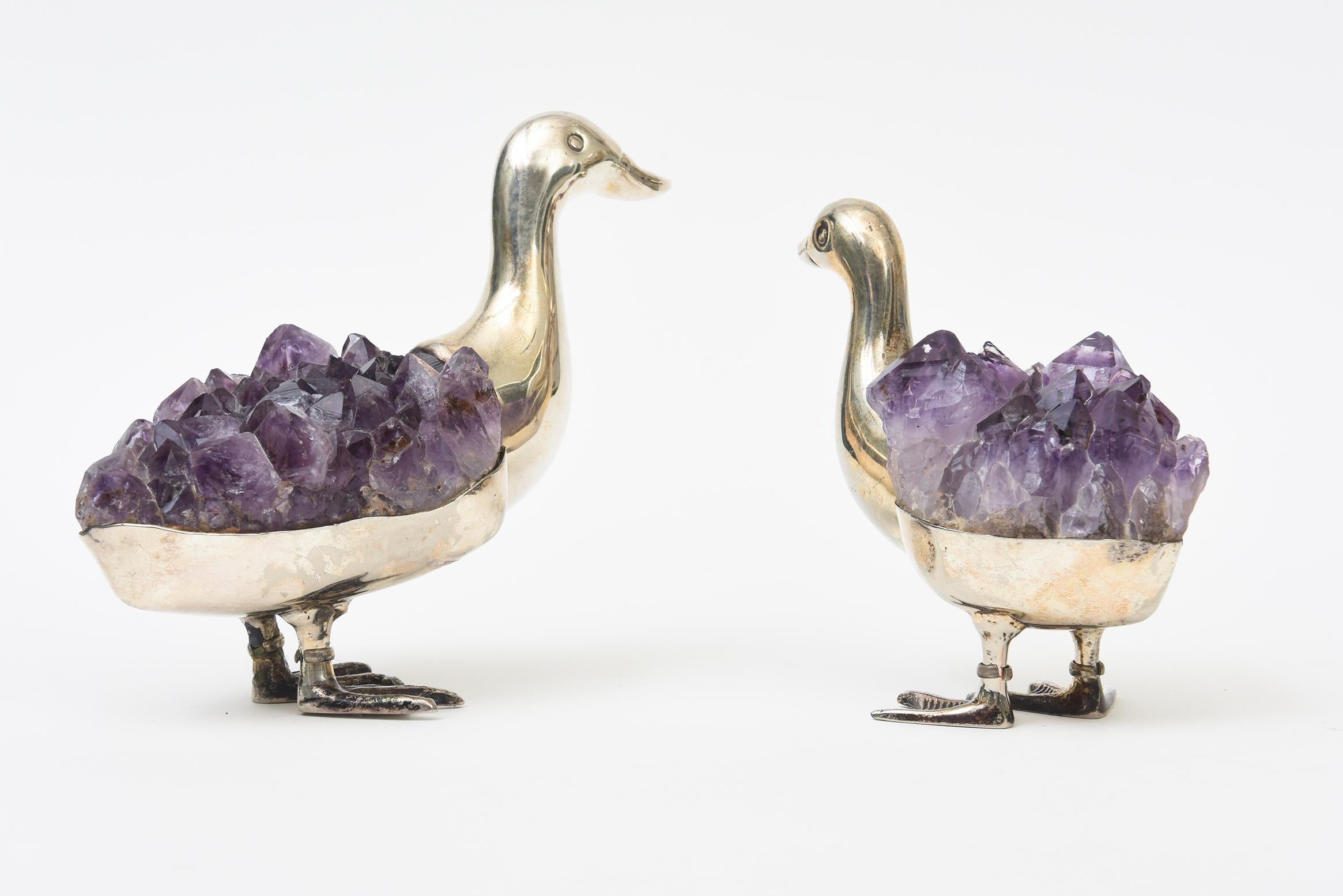 This pair of vintage signed Gerson Silver-Plate duck sculptures and or objects have amethyst bodies in layers. Gerson is a Brazilian artist and these are both signed  Gerson BA-P 90. They are whimsical, charming,  enchanting and look like they are