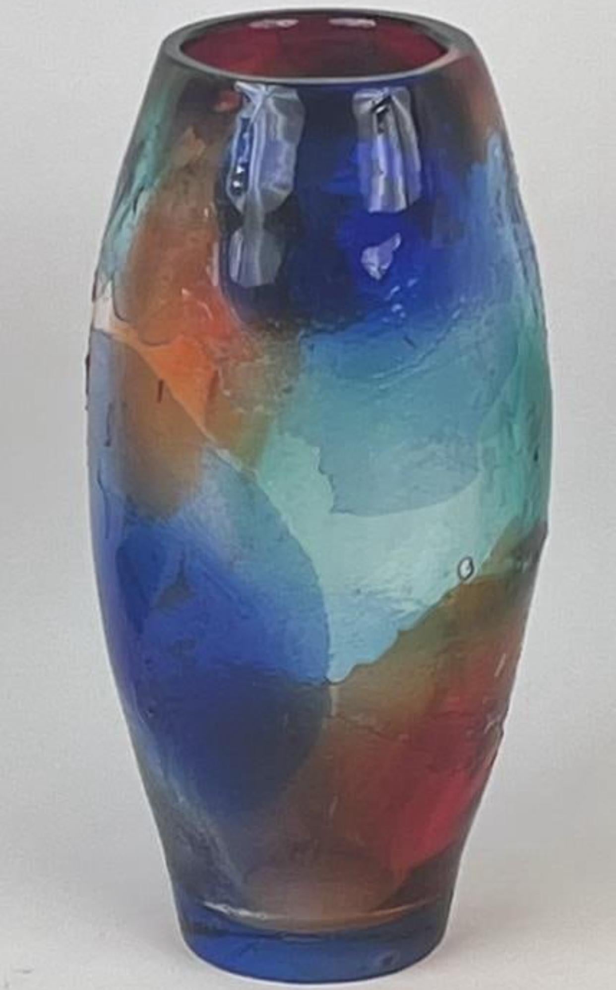 Large and colorful hand blown Murano glass vase by Maestro Giuliano Tosi. Vibrant colors of blue, orange, green and red that blend with and overlap one another. Raised shapes and textures also add to the unique form of this vase by one of the art