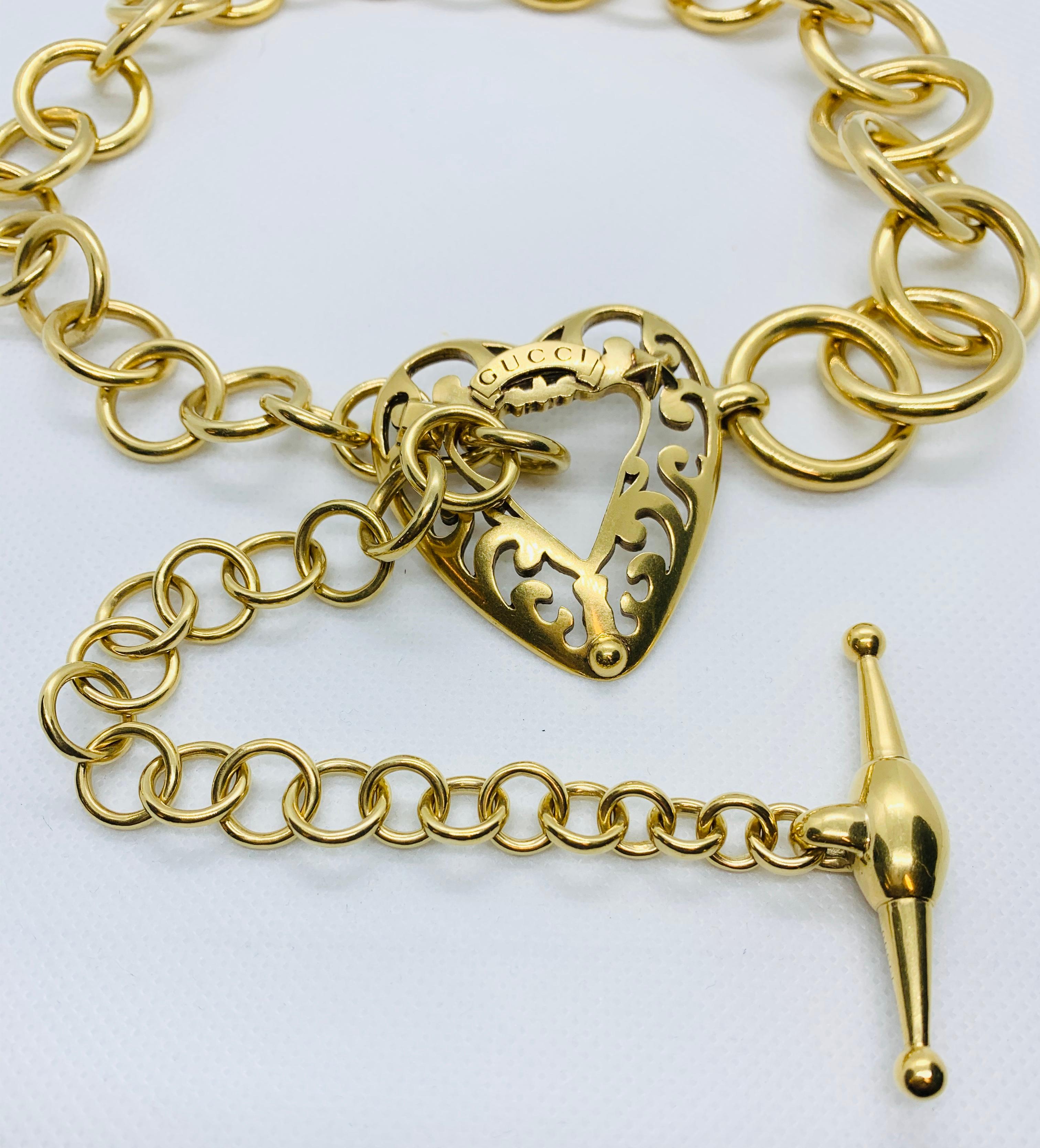Signed Gucci 18 Karat Gold Link Toggle Necklace with Heart Shaped Center Piece 10