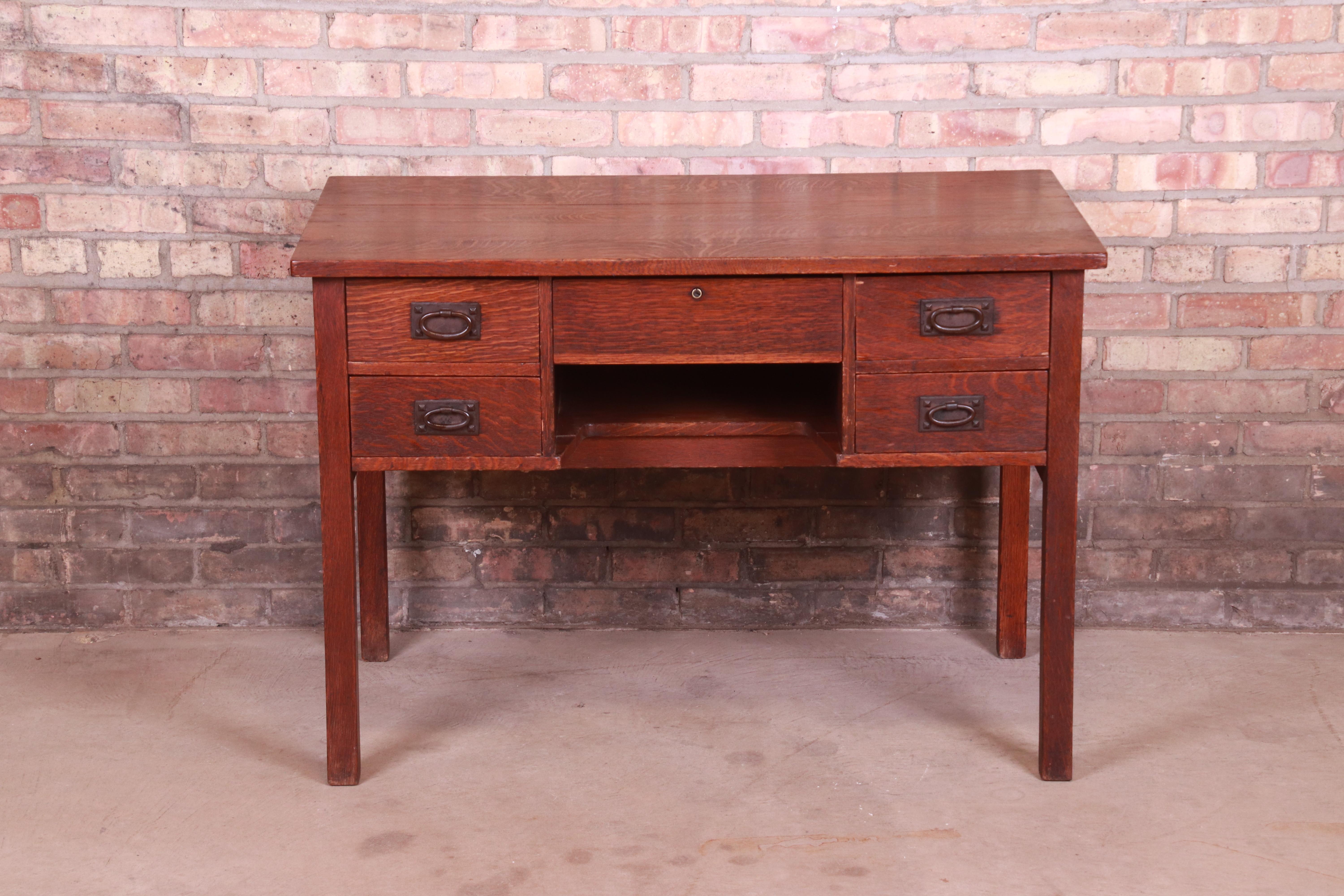 A rare and exceptional antique Mission oak Arts & Crafts writing desk

By Gustav Stickley (original label present)

USA, Circa 1900

Solid quarter sawn oak, with original hammered copper hardware.

Measures: 42