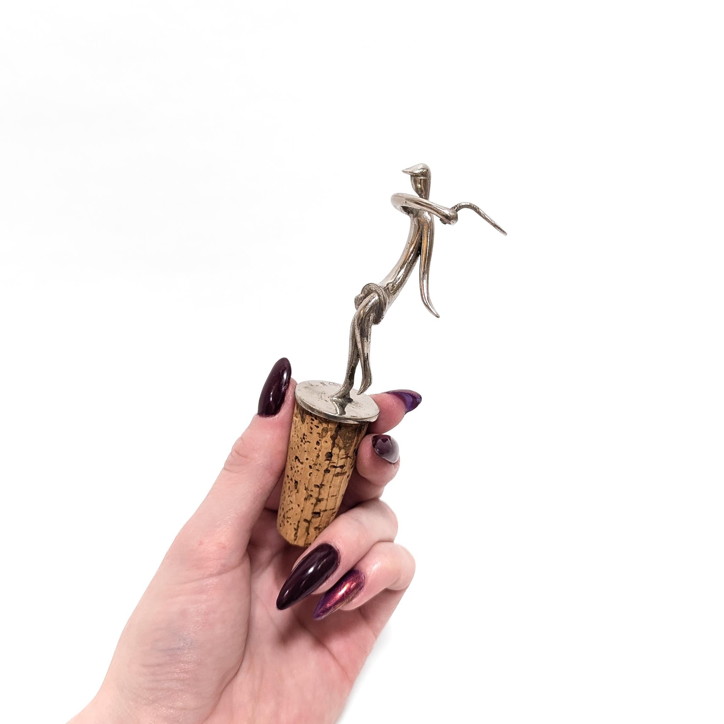 A fine antique Austrian Art Deco figural chrome plated wine cork or bottle stopper.

By Hagenauer.

In the form of a figural woman in a dress and cap swinging a tennis racket.

Fullly marked to the base.

(We have seen these tennis figures simply as
