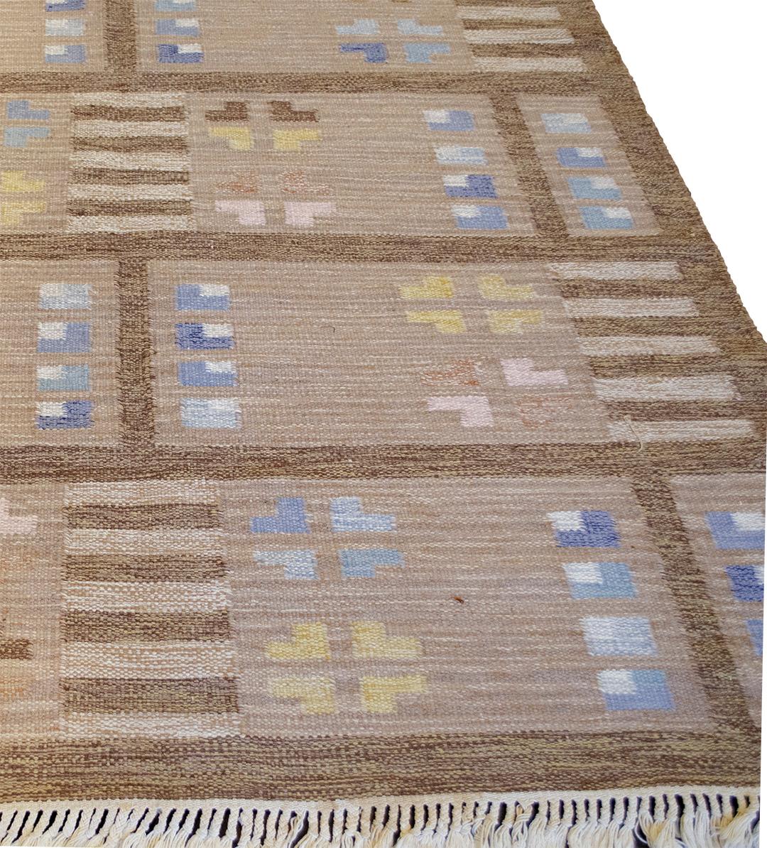 This vintage handwoven signed Swedish rug has a shaded refined mole brown field with scattered varied geometric shapes, in a darker brown border. Signed by the original artist.