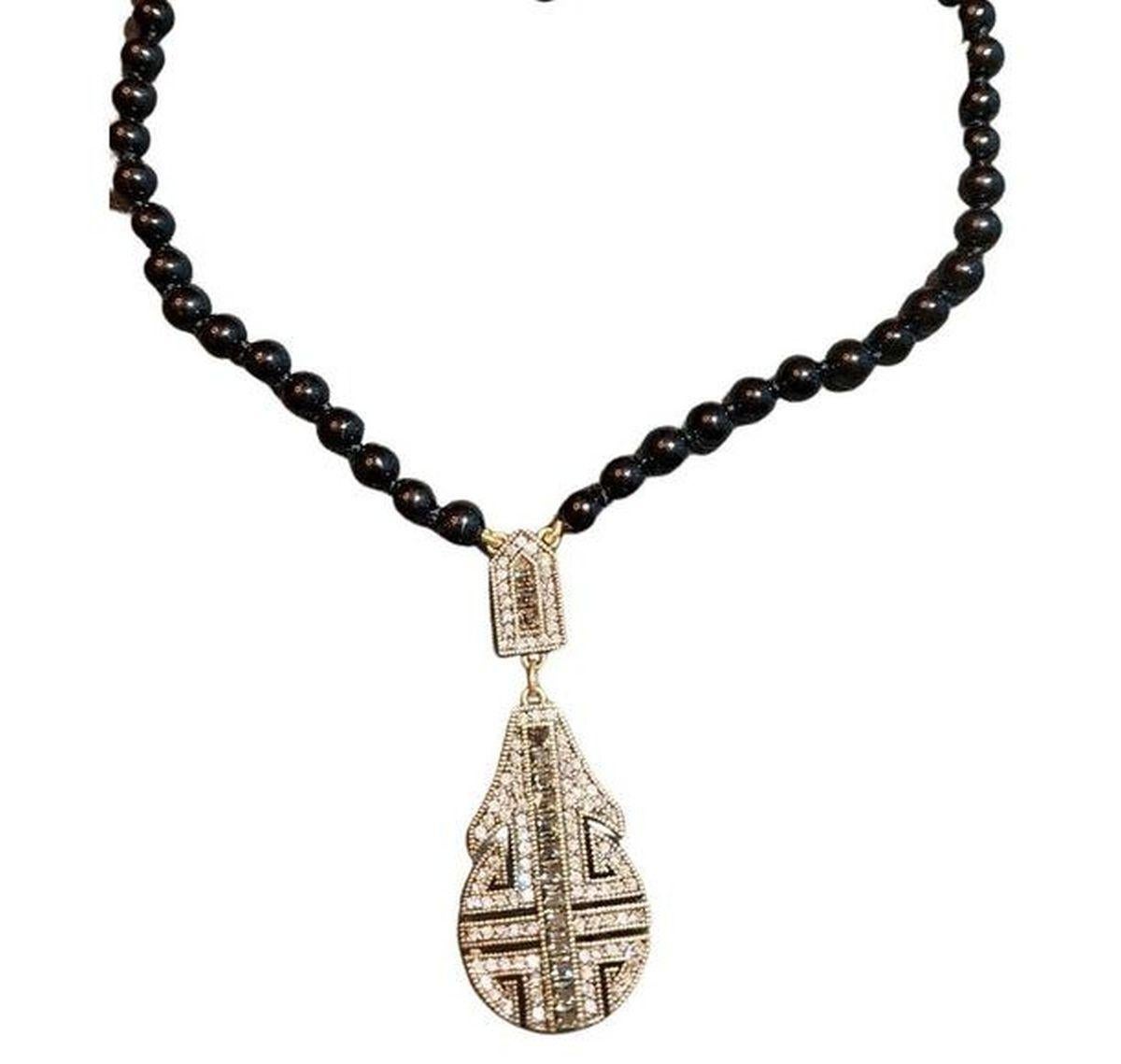 Simply Beautiful! Signed Heidi Daus Designer Black Bead Necklace suspending an Art Deco Revival Sparkling Crystals Pendant. Gold tone setting. Signed HEIDI DAUS. Necklace measures approx. 18” long; with extender chain allows adjustable length(s) up