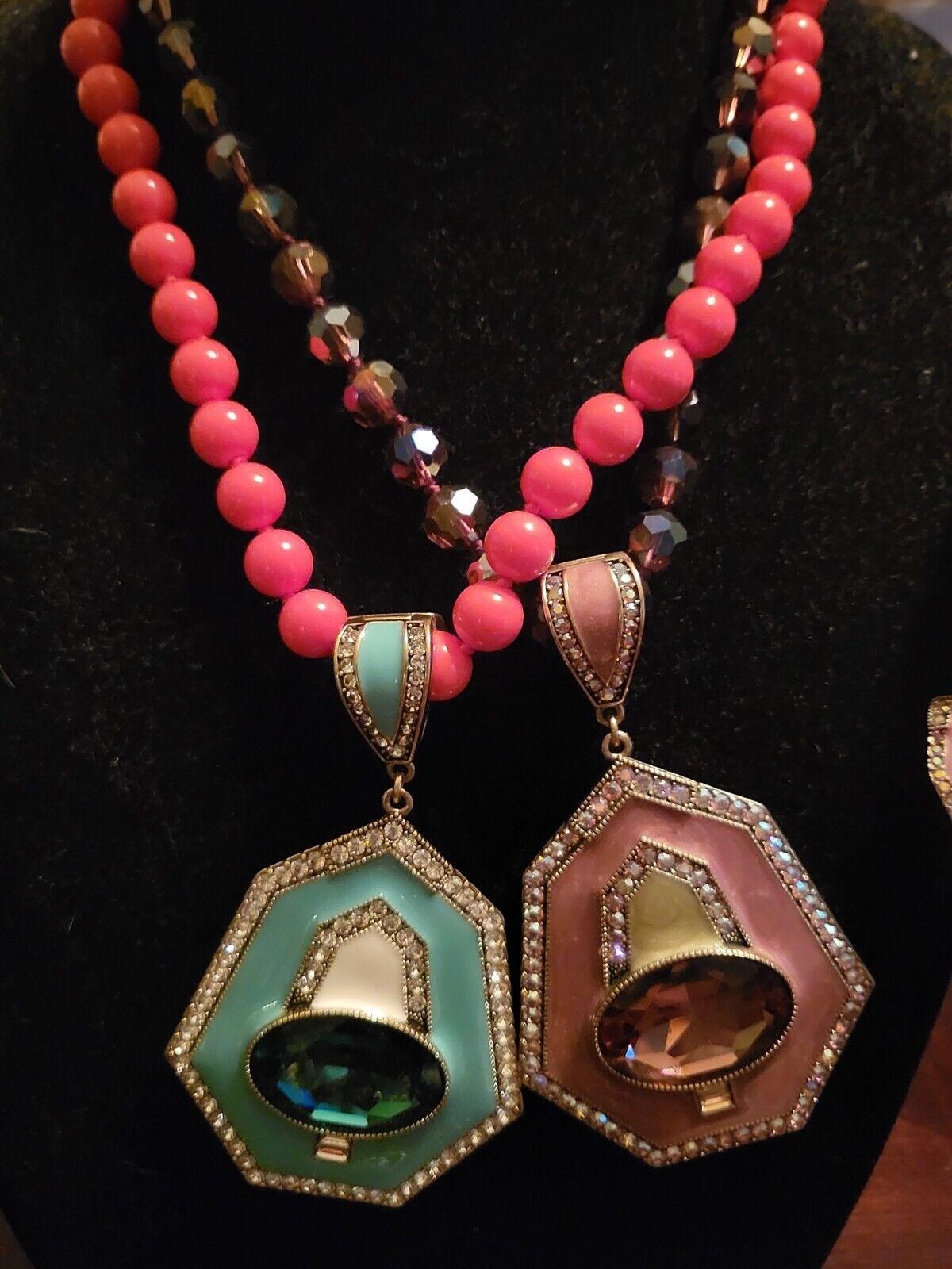 Simply Beautiful! Signed HEIDI DAUS Designer Vintage Enamel and Sparkling Crystal Pendant Necklaces and Clip Earrings. One set is Turquoise enamel with a faux Coral Beads Necklace. The other a Beautiful Mauve/soft Pink shade with an Aurora Borealis