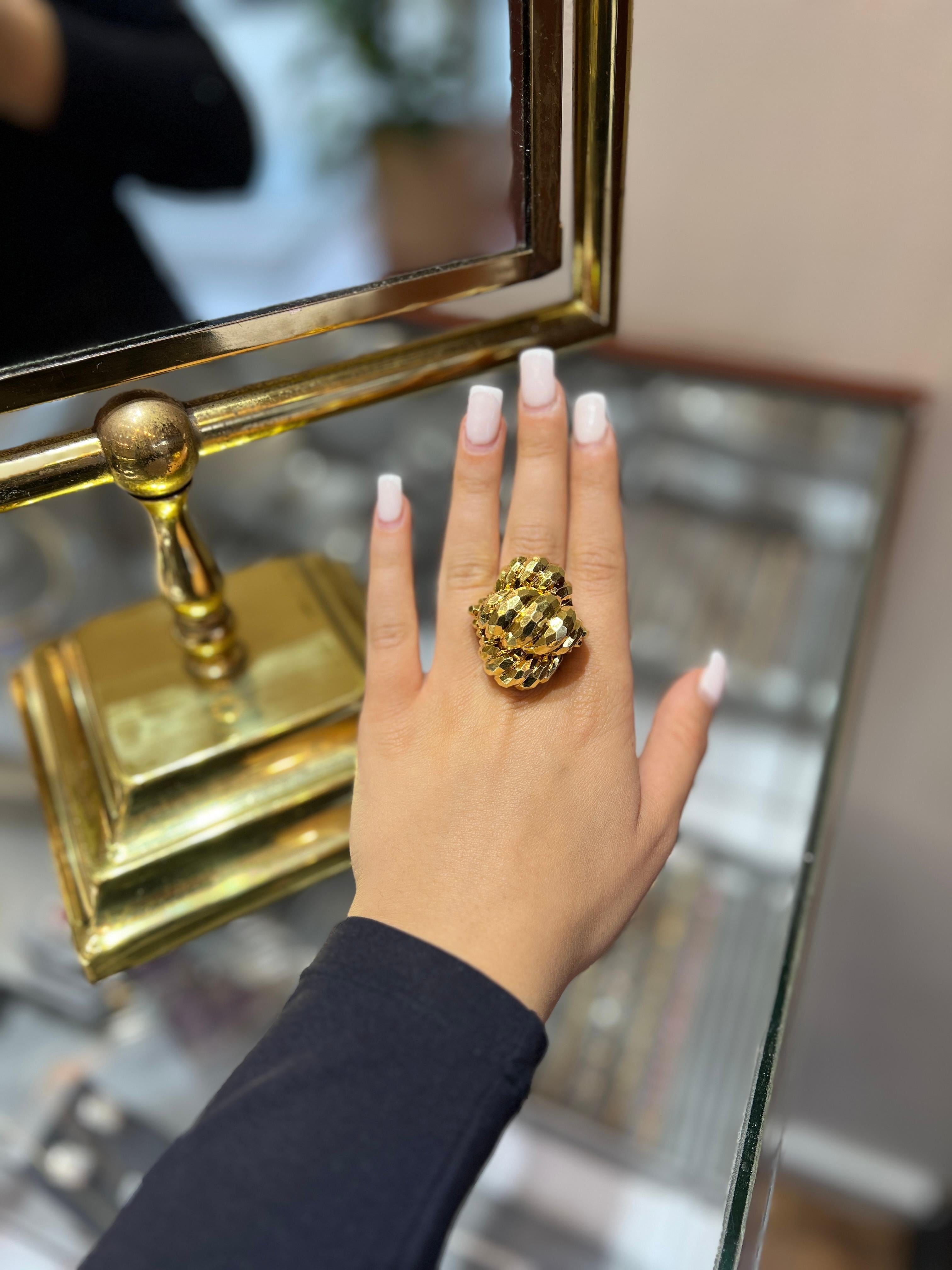 Henry Dunay Solid Gold Hammered Design Very large Handmade Ring, Solid 18k (750 Hallmark). This Ring is the epitome of 1980s jewelry culture of having bold finished pieces that scream. This solid piece of art is created with shiny textured facets