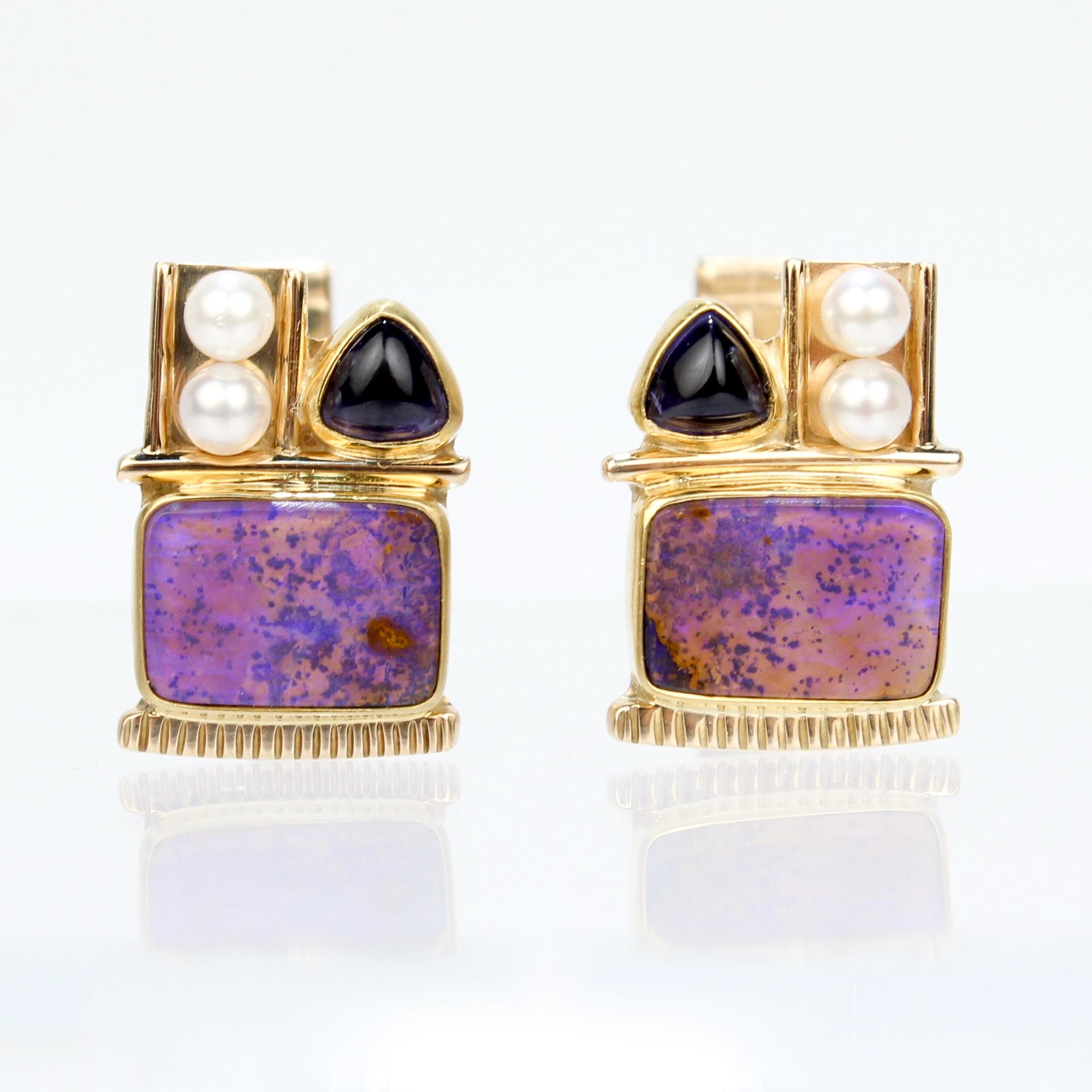 A pair of fine signed high karat gold Memphis School style cufflinks.

Each with a bezel-set, rectangular purple opal cabochon, a bezel-set triangular amethyst, and 2 pearls.

Marked to the reverse of each with a maker's mark / 14k / 22k and marked