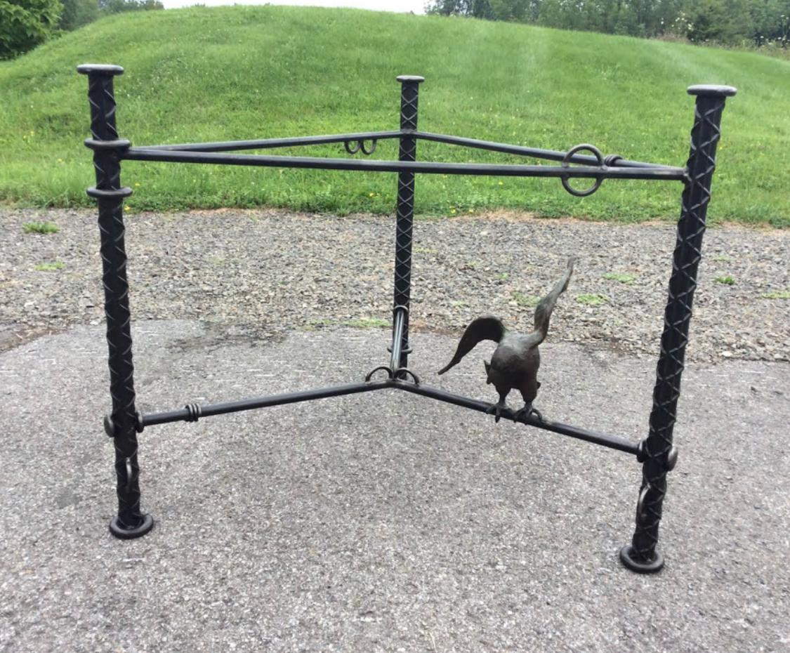 Fantastic Ilana Goor steel and bronze dining table with glass top. Table base is steel with a cast bronze bird. Base is in great condition, with minor wear and a nice patina to the bird. Base is signed Goor 37/100 and her signature is cast into the