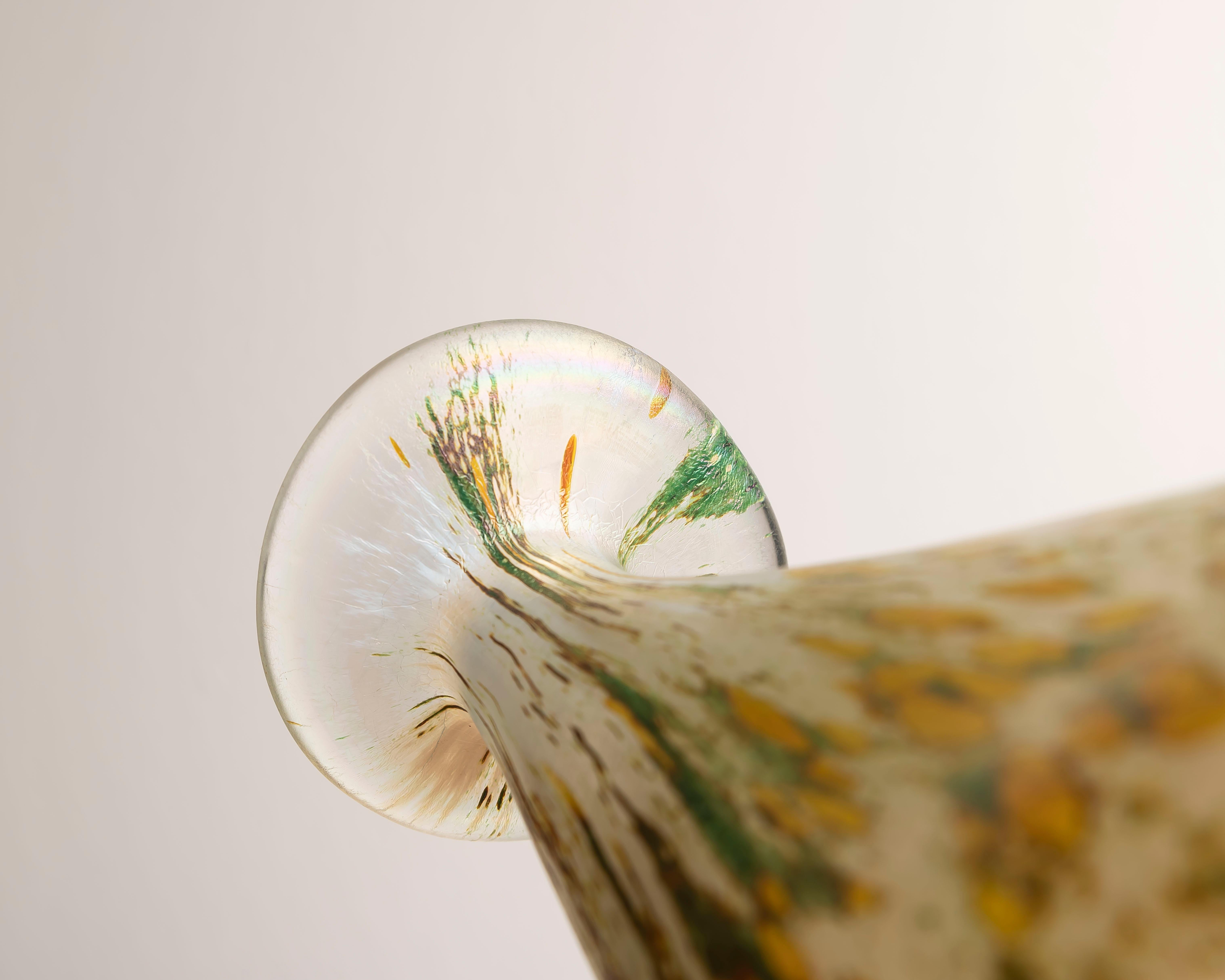 Hand-blown studio glass vase, signed and dated ’86 to the underside (signature illegible; see macro photos). The organic drop-form rises to a flattened “mushroom” lip, while an iridized surface throws shifting tones of gold/amber, green and soft