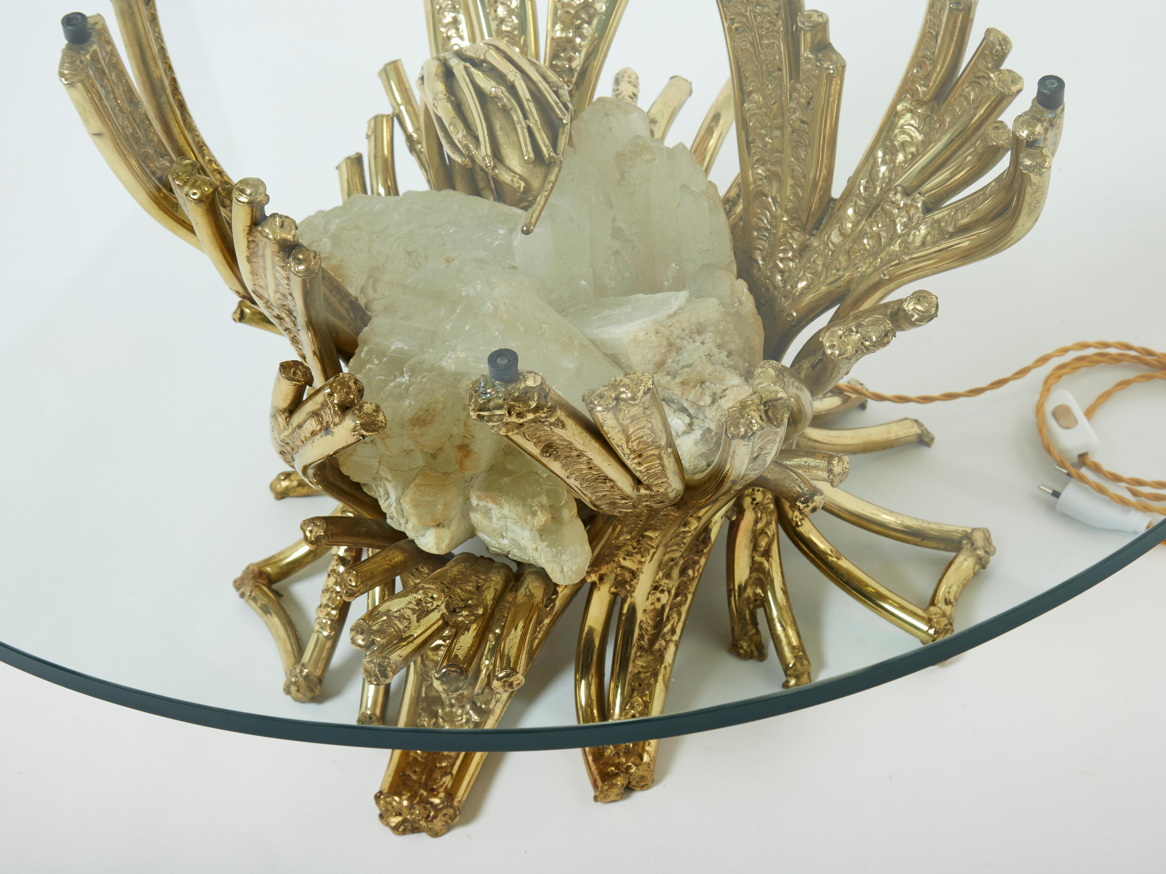 The creative design of this coffee table by Isabelle Faure is really something. Tangled in a web of heavy brass branches is a beautiful assembly of quartz stones, lit from the inside, and topped with a thick round transparent glass. Entering a room,