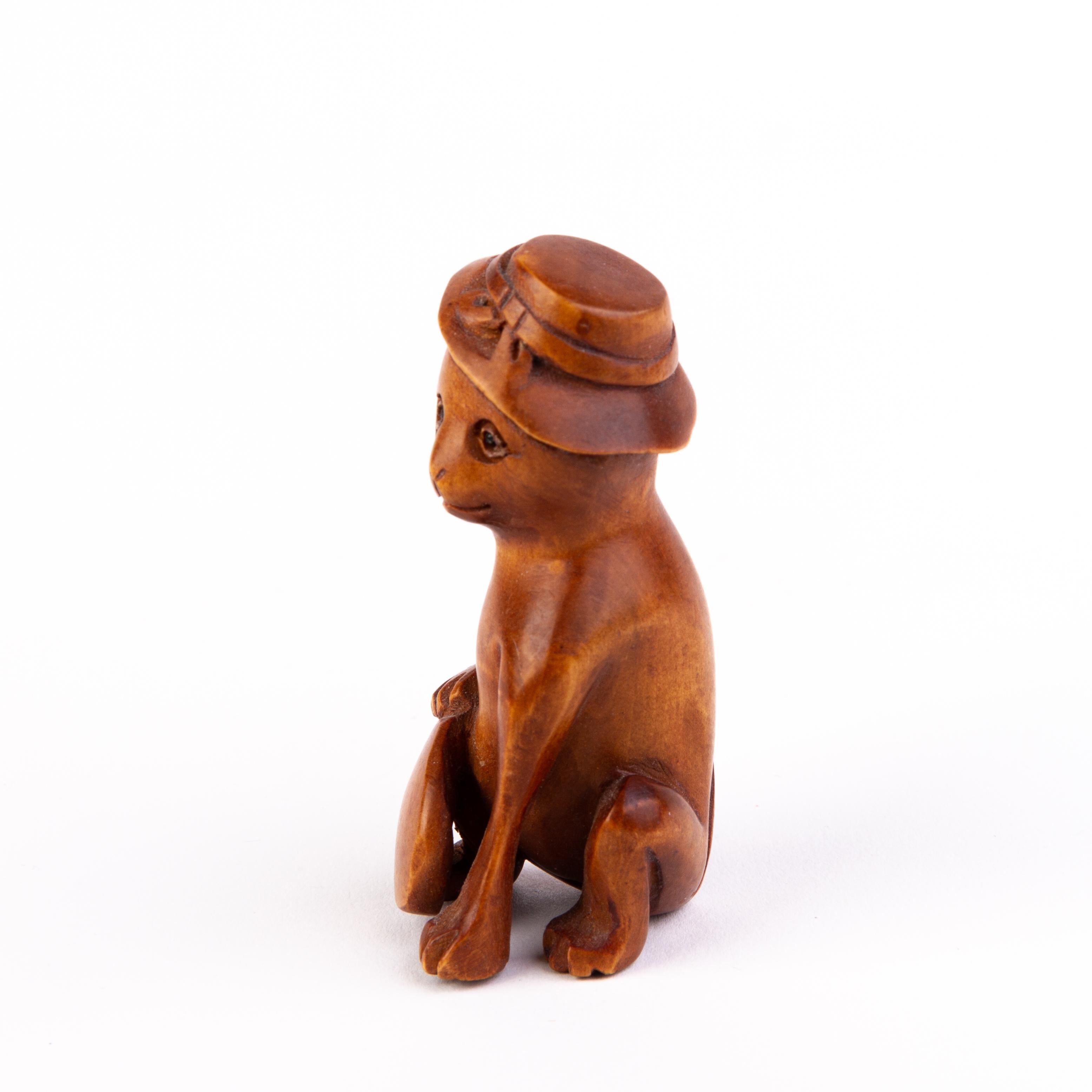 20th Century Signed Japanese Carved Boxwood Netsuke of a Cat with Hat For Sale