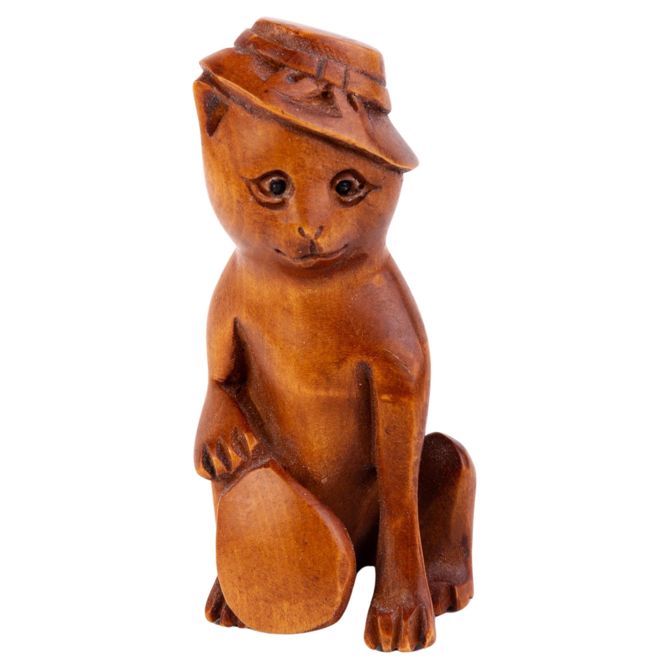 Signed Japanese Carved Boxwood Netsuke of a Cat with Hat For Sale