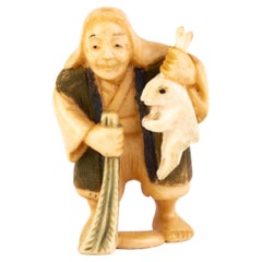 Inro japonais sculpté Tagua Nut Netsuke d'un chasseur