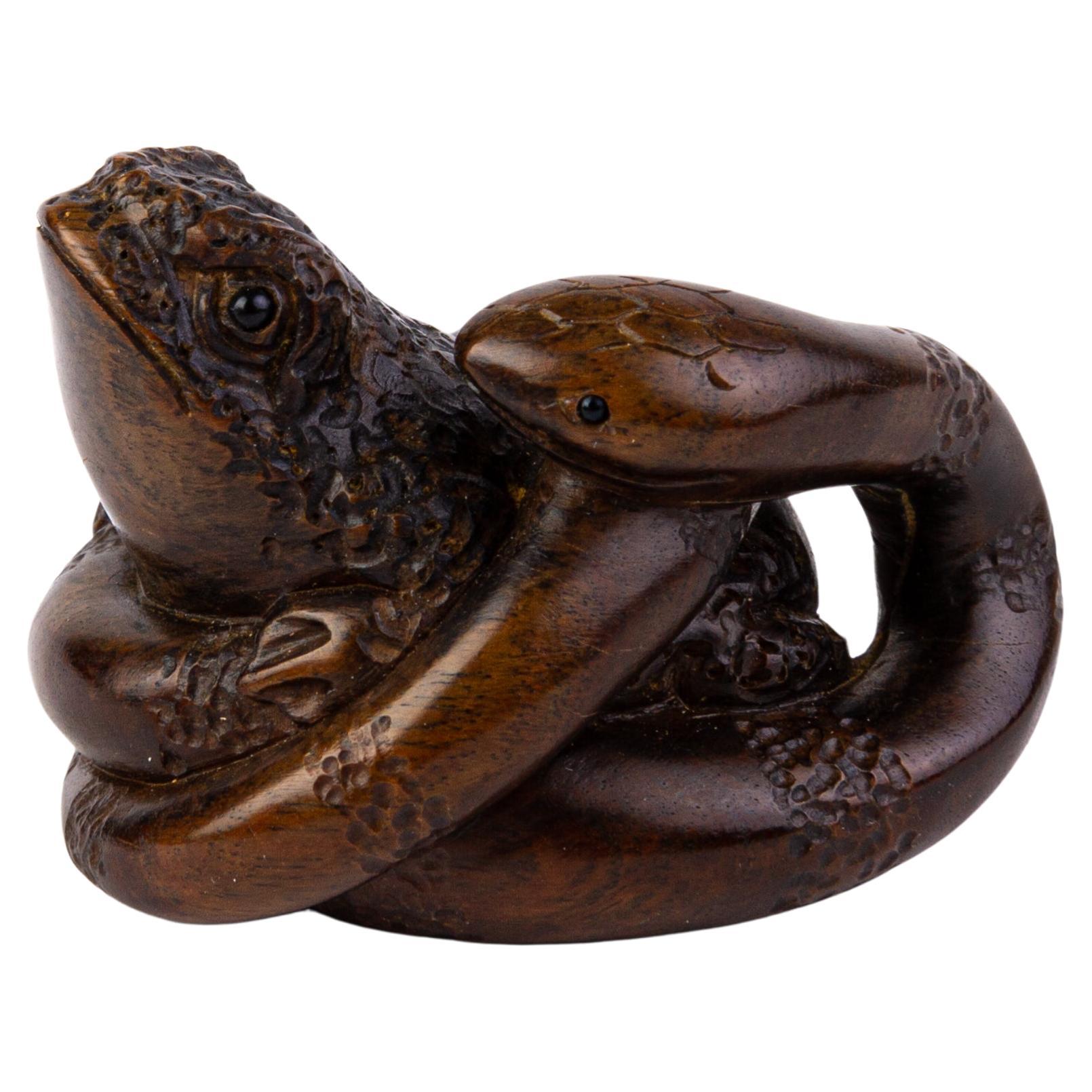 Signed Japanese Dark Wood Netsuke of Snake Trapping Toad For Sale
