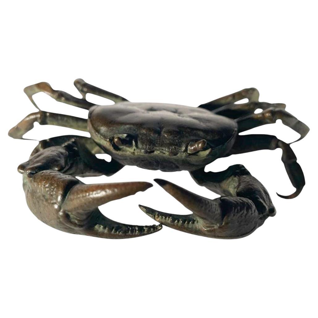 Signed Japanese okimono of a realistically modeled crab raised up on its toes and with claws raised. One of 5 designated by (E) in the title.