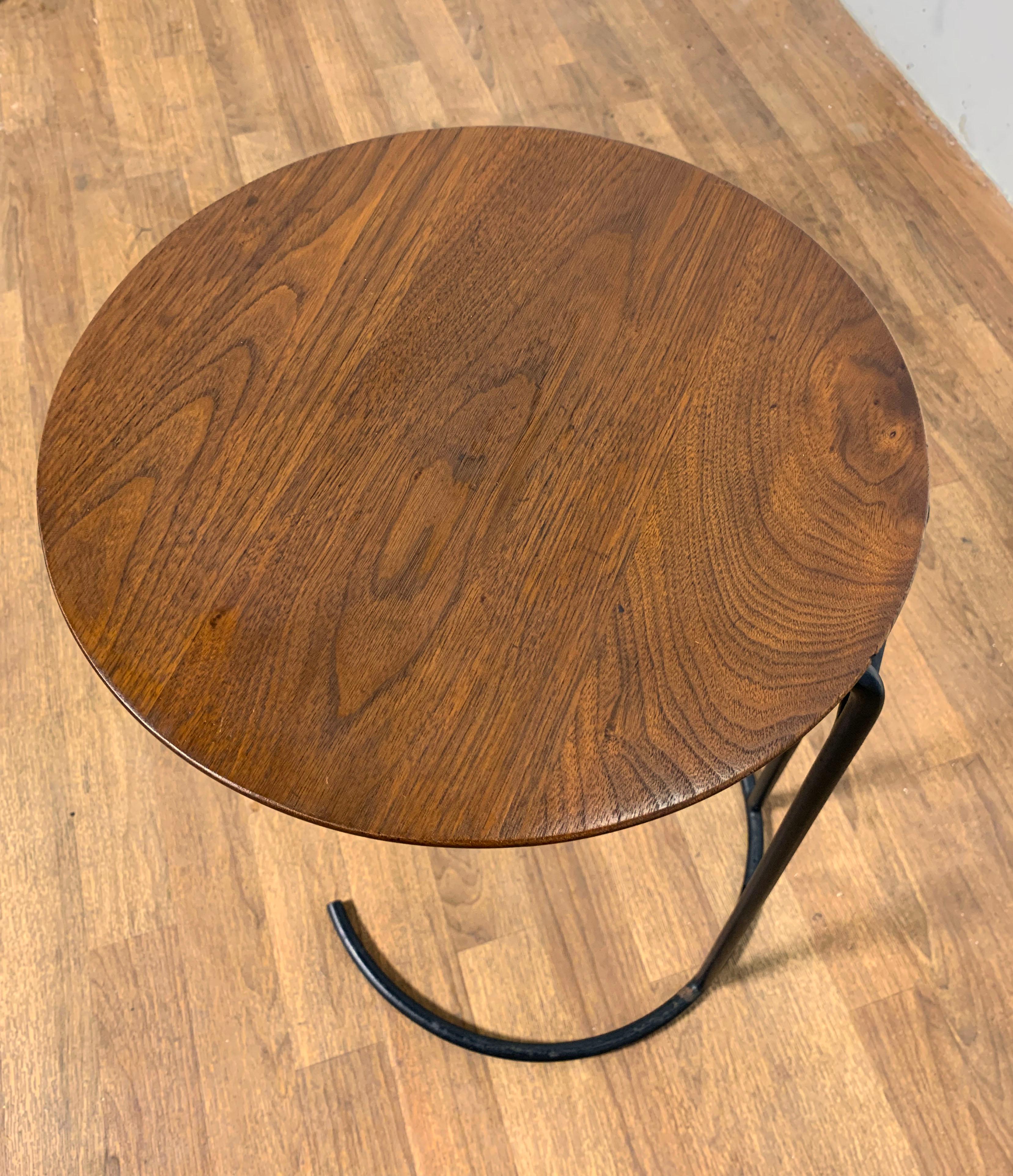 A Model T710 side table in walnut and steel by Jens Risom, circa 1950s. Retains its original label.