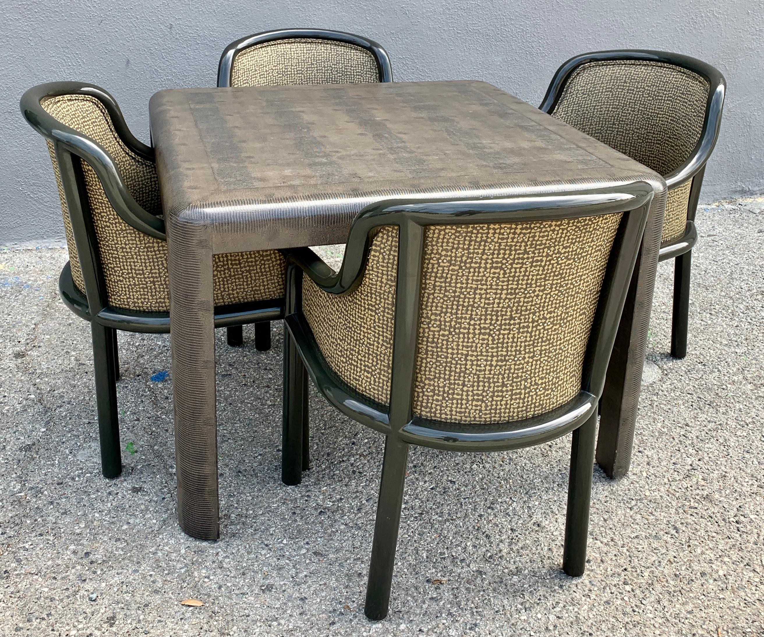 Signed Karl Springer Game or dining table. The table is leather embossed lizard, in very good vintage condition. Four lacquered chairs with very good upholstery - all coordinating in color and style. We can also reupholster with COM if working with