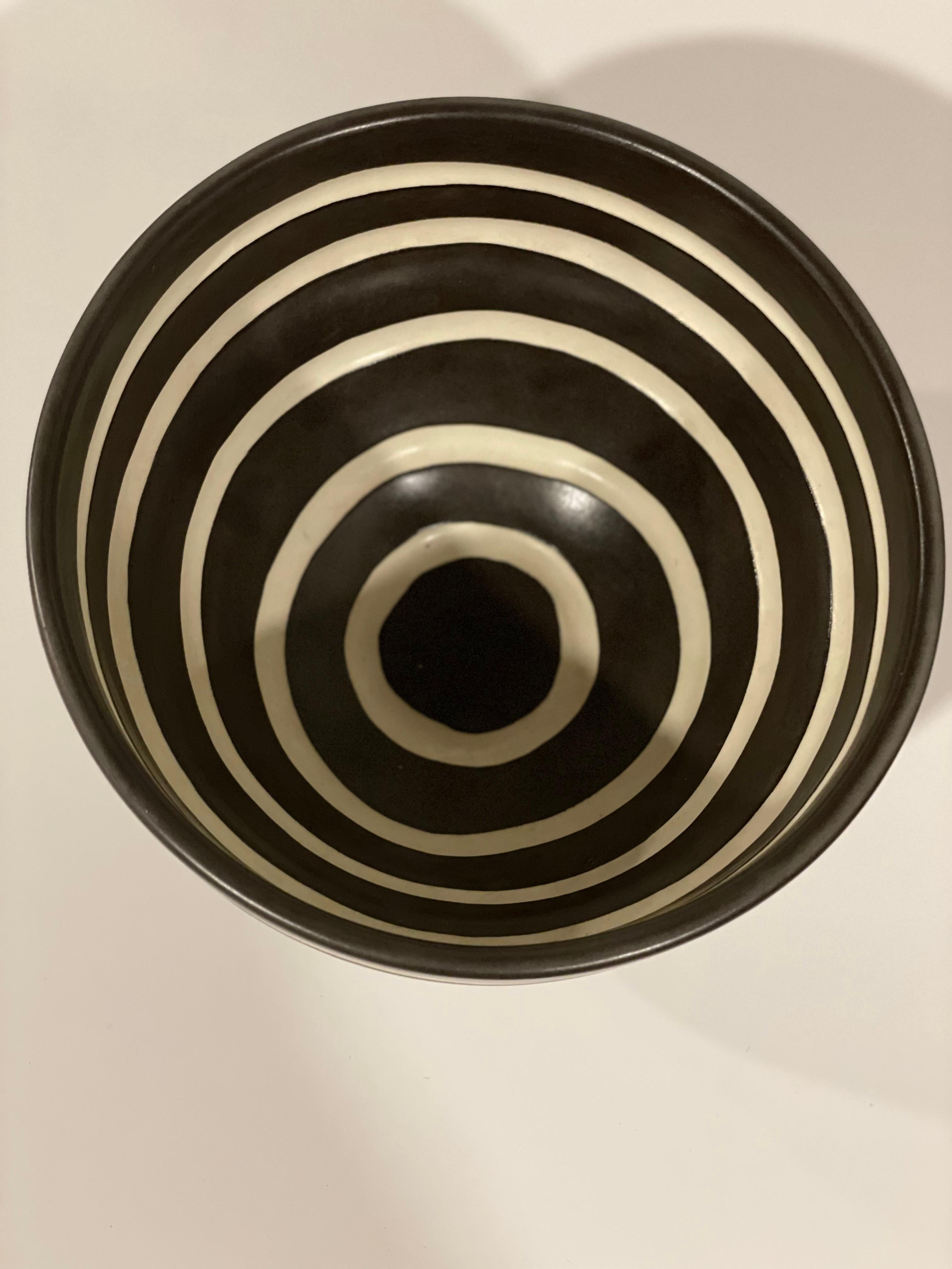 Beautiful Signed Kathy Erteman ceramic bowl with carved designs. Black and White paint gives the piece dimension. Minimalist aesthetic.