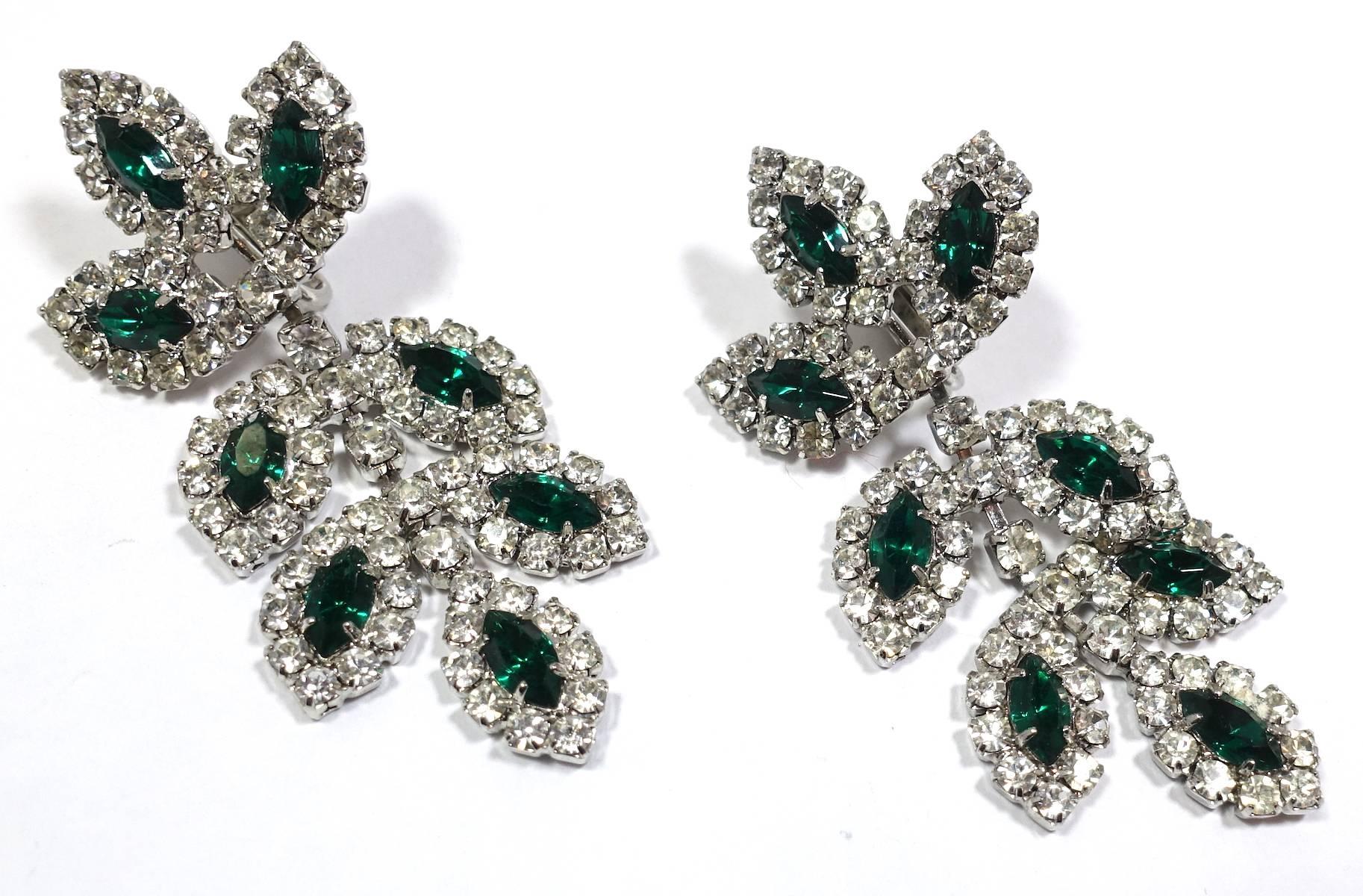 These Kenneth Lane clip earrings amazingly match the green and clear Les Bernard crystal necklace.  They feature green and clear crystals in a silver tone setting.  These earrings measure 2-1/2” x 1” and are signed “Kenneth Lane”. They are in