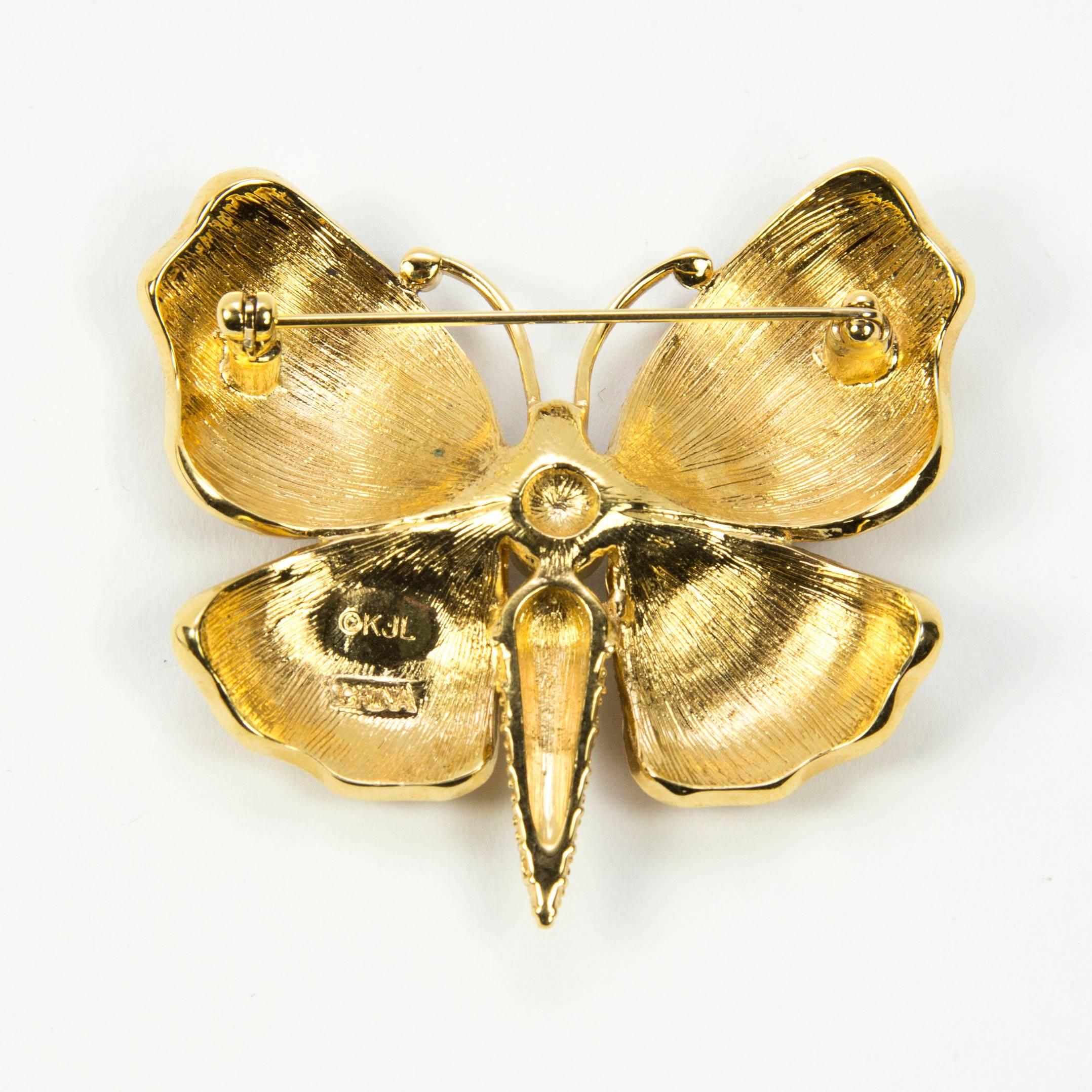 Awesome Enamel Butterfly brooch enhanced with sparkling Faux Diamonds; signed on reverse: KJL. Classic, Stylish, Beautiful and Fun to Wear! 
