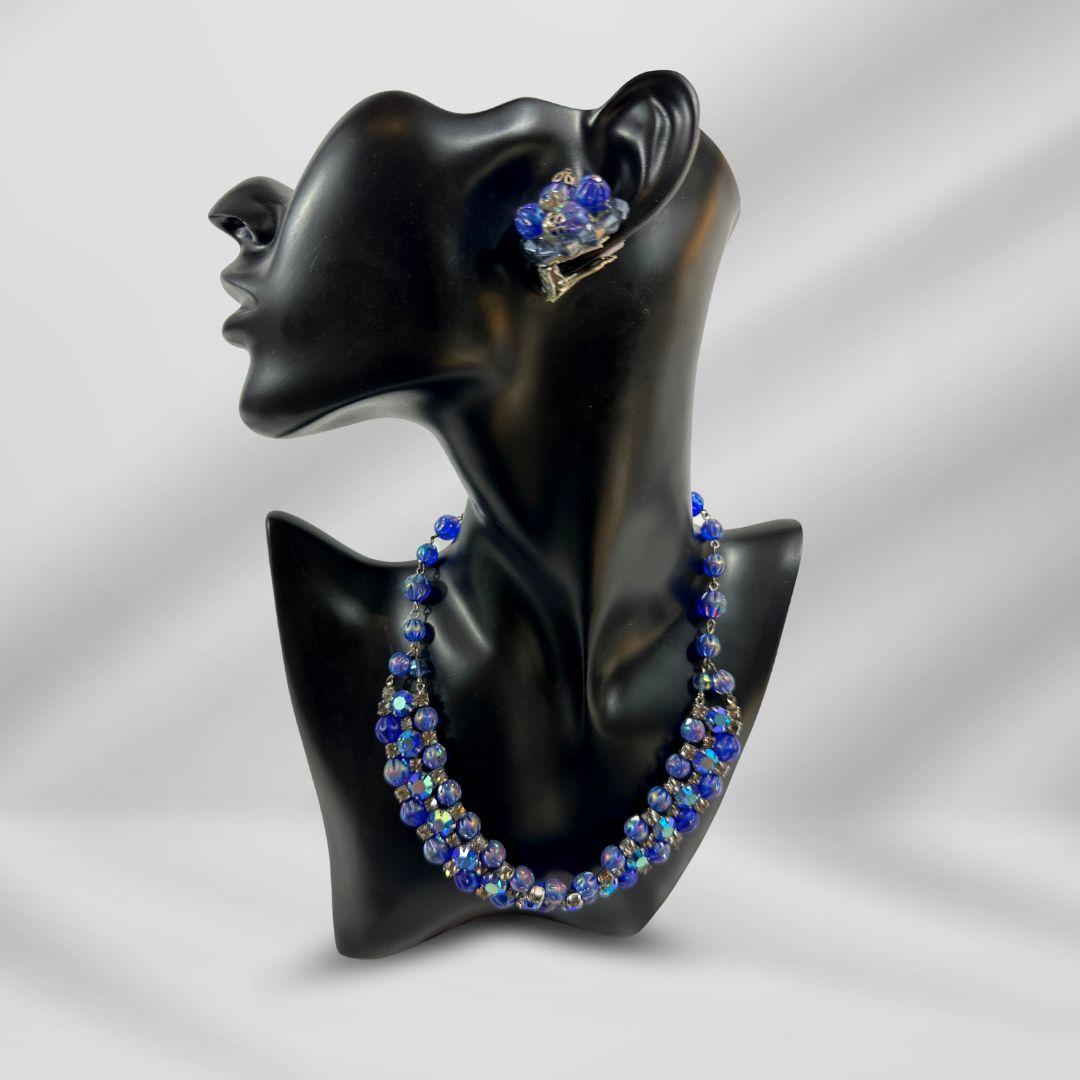 Necklace Length: 16″
Earrings diameter: 1″
Bin Code M11 / P15
Experience the enchanting allure of vintage glamour with this Kramer Signed Shimmery Blue Borealis Glass and Rhinestone Vintage Necklace & Earrings Set. Crafted with meticulous attention