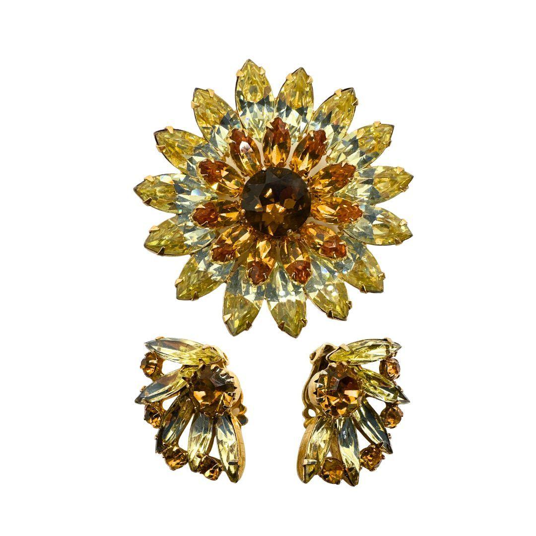 Pin Diameter: 1.98″

Rearring Length: 1.10″

Bin Code: E5 / P10

Elevate your style with the exquisite beauty of our Vintage Multi Shade Champagne Sunflower Kramer Pin & Clip-on Earring Set. This stunning jewelry ensemble combines vintage charm with