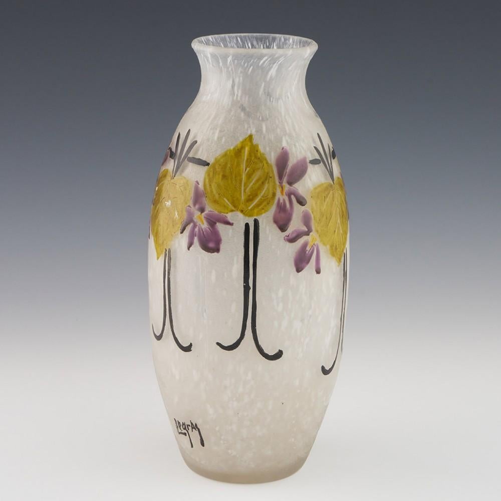 Heading : Signed Legras Art Deco glass vase
Date : c1930
Origin : St. Denis, France  
Colour : Clear glass with black, violet, and green enamelling 
Bowl : . Cameo vine leaves and grapes. Enamelled vine supports. Raised clear glass scrolls and swags