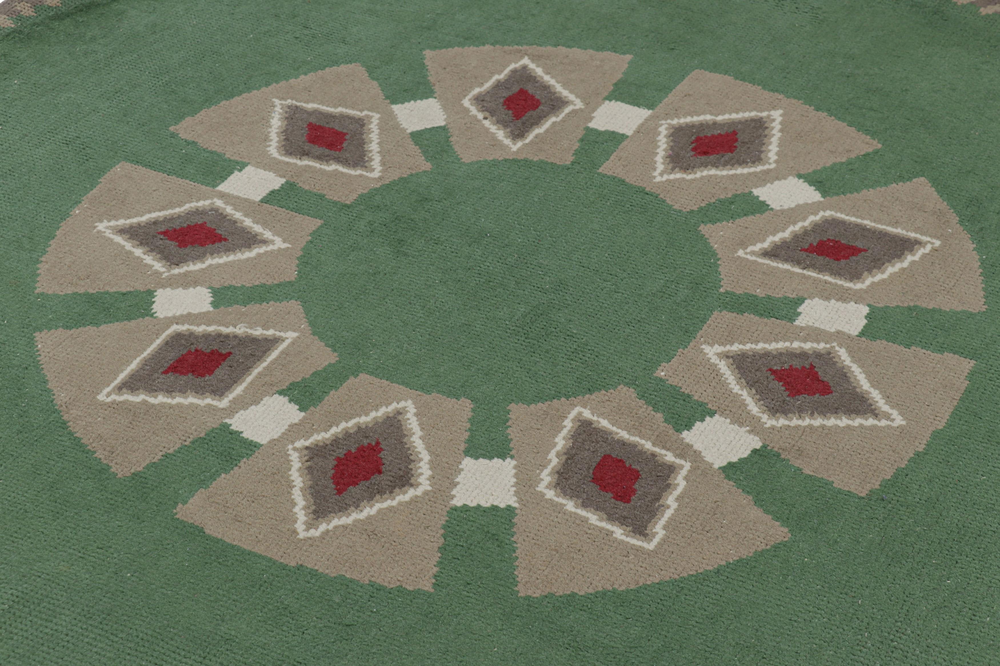 Made with hand-knotted wool in France circa 1950, this 6x6 vintage French Art Deco rug is an extremely collectible mid-century circle rug from Leleu Decorateur—the work of an iconic family label known for their impact on an iconic design