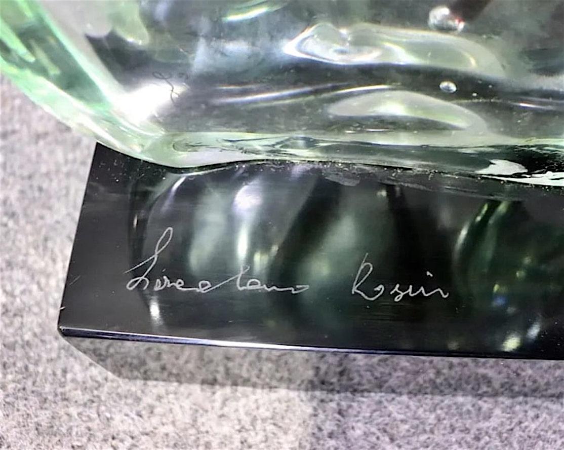 Signed Loredano Rosin (Italy 1936-1991) sculpture of a nude suspended in clear acrylic. Set atop a polished black stone base with the artist's signature etched.
Please confirm location NY or NJ
