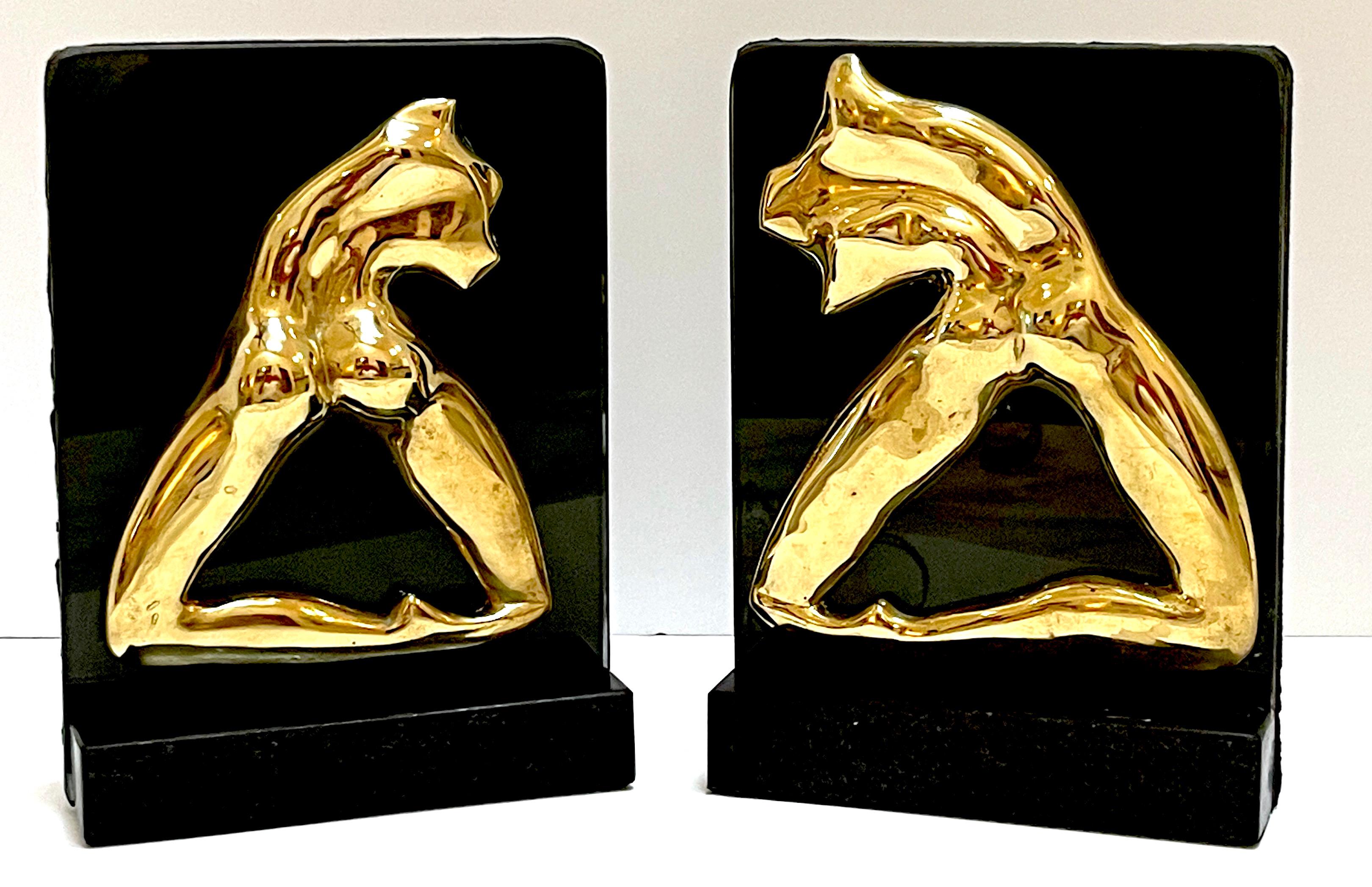 Signed, M. Lima Abstract Bronze and Glass Bookends, Nude Profiles, circa Late 20th Century

A striking pair of sculptural bookends by M. Lima, featuring polished cast bronze reliefs mounted on black glass and marble bases. Executed in an expressive,
