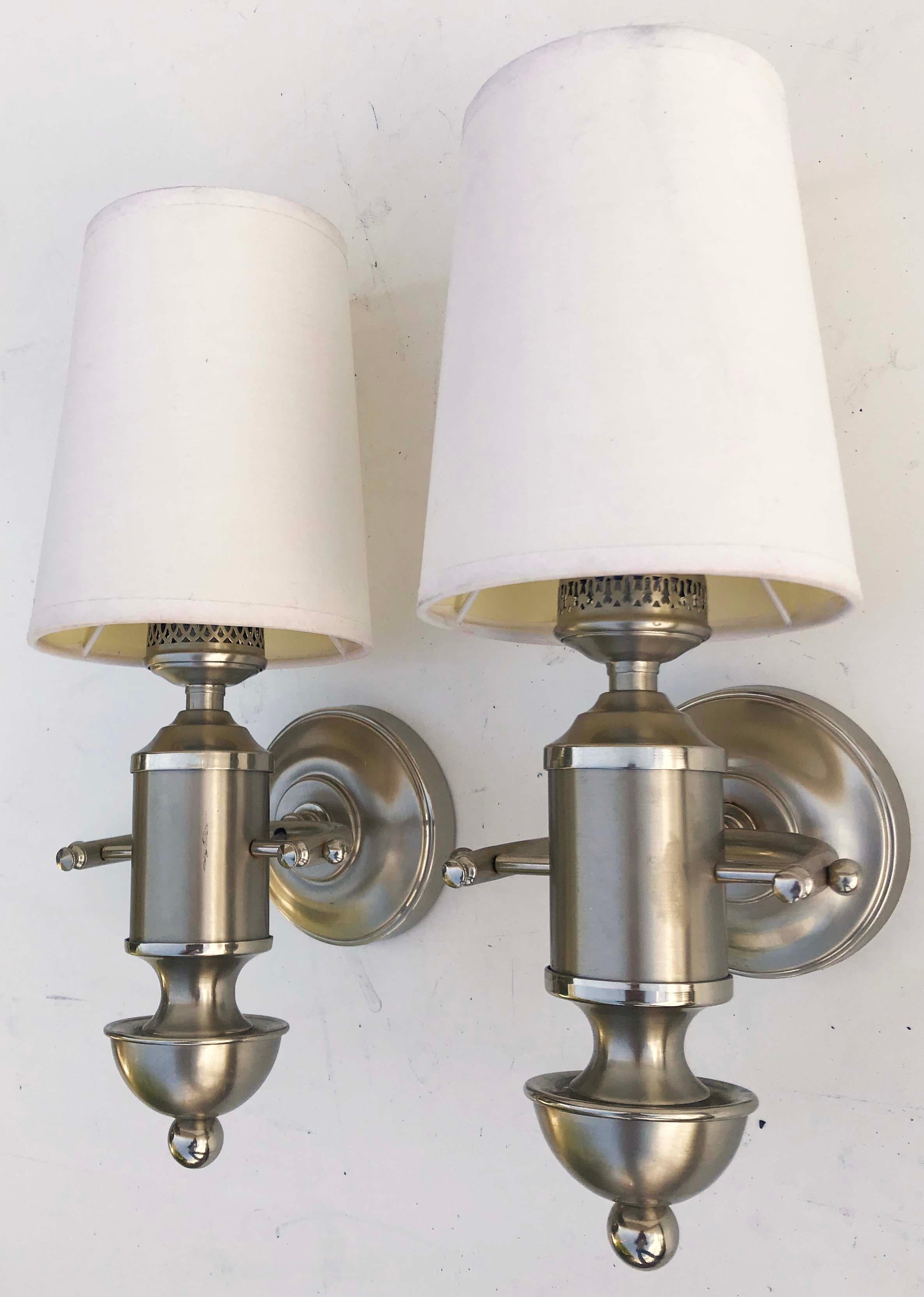 Superb pair of signed Maison Charles Yacht sconces, nickel-plated brass.
Top quality French sconces.
US rewired and in working condition
1 light, 25 watts max bulb.
Back plate: 4