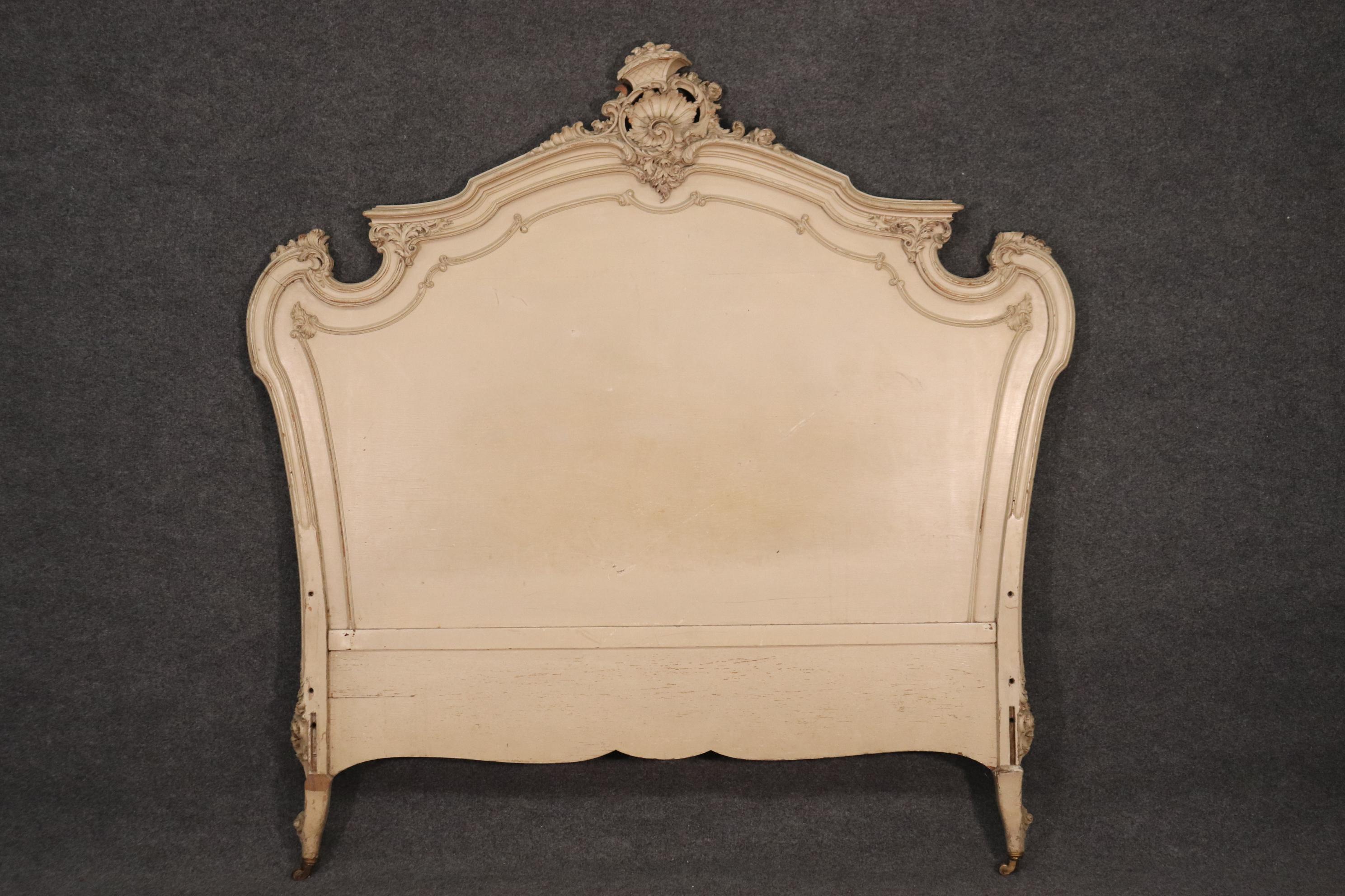 This is a beautiful heavily distressed antique painted headboard and footboard. There are no rails but rails can be made or substituted by a metal frame. The bed has chips, nicks and signs of wear and is in good antique condition. It is signed