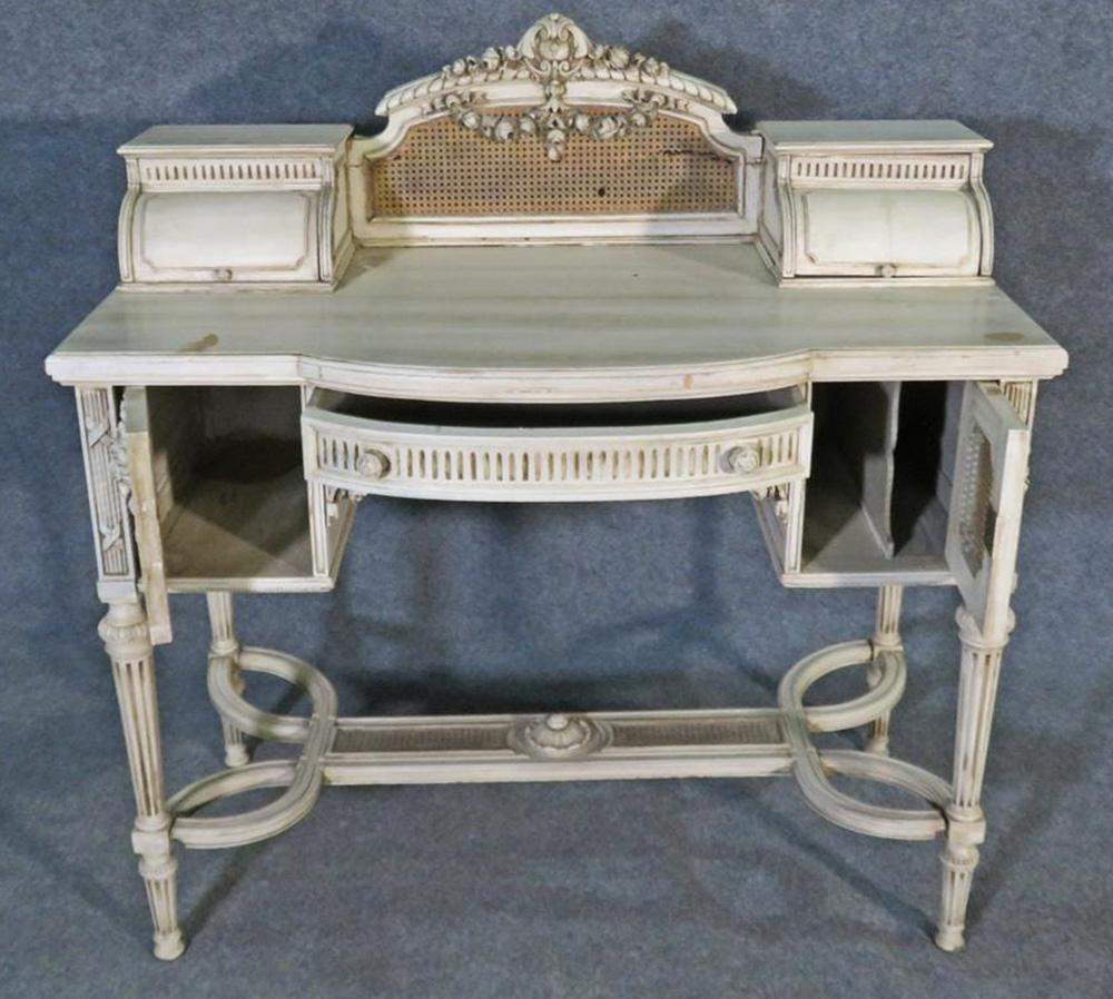 This is a beautiful signed Maison Jansen ladies vanity or writing desk The vanity does have some minor signs of age and wear including damage to the cane and some other issues, but it is 100 years old and dates to the 1920s. The vanity measures 42