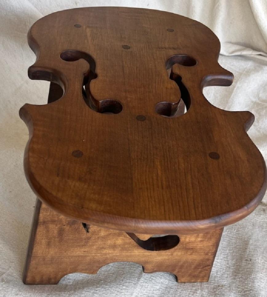 Fabulous Maple Violin with musical notes on the side of the footstool. 
Within the interior of the foot stool it is Stamped - 