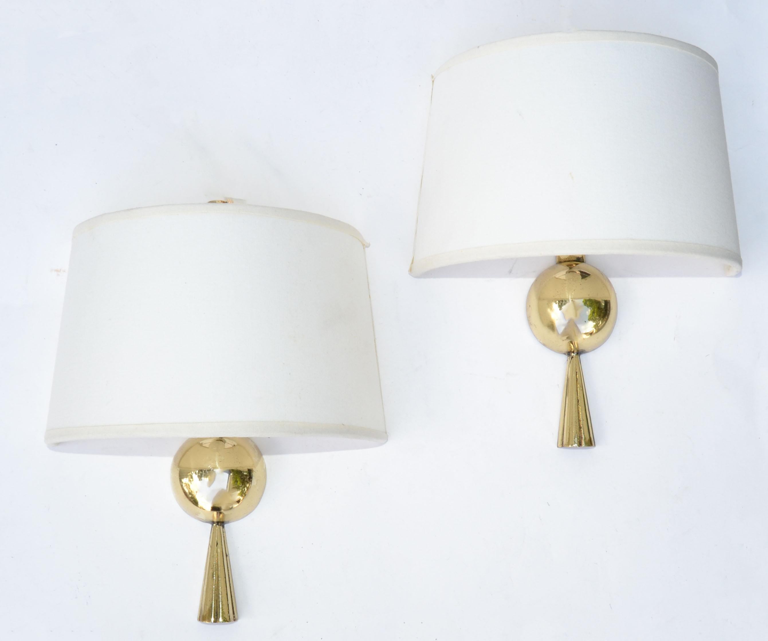 Pair of Polished Bronze sconces, wall lamps signed by Marcel Guillemard.
In working condition and each takes a max. 60 watts candelabra light bulb.
Sold with newly made Custom Shades.
Measures: 8 x 5 x 4 inches Height.
Projection from the wall: