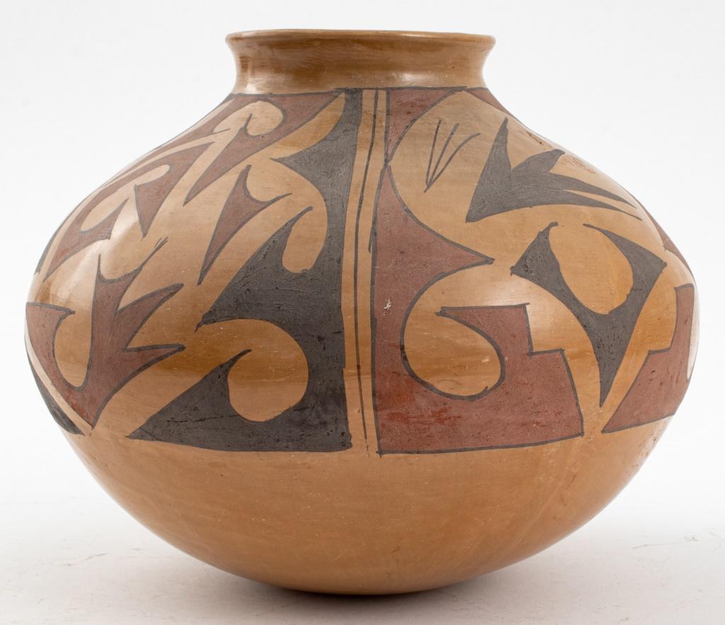 Casas Grandes Mata Ortiz Native American hand-coiled ceramic pottery olla vase, circa 1970, the cream ground with scratched and painted red and black geometric design, incised 