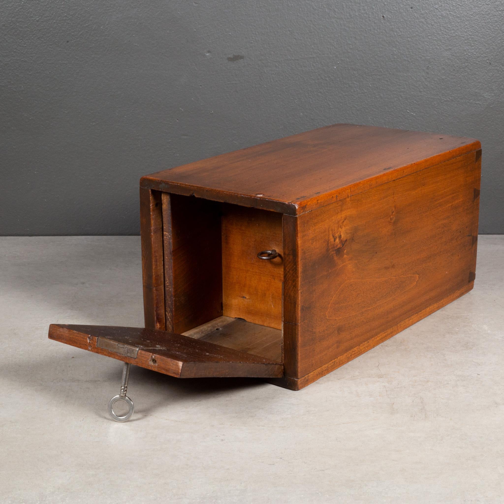 ABOUT

A mid 19th century handmade wooden lock box with original key and pull out inner compartment. Signed inside 