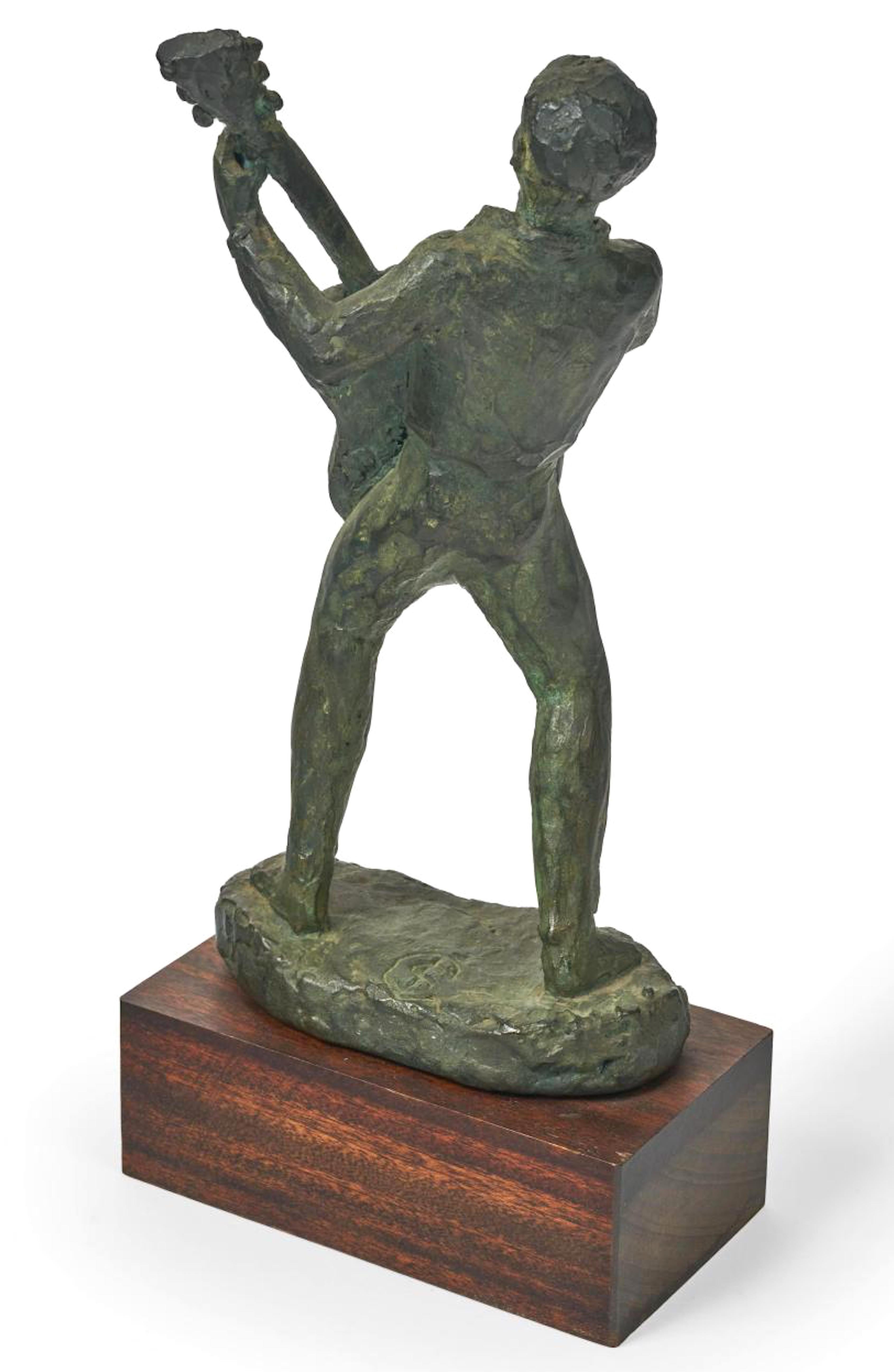 Great little Mid-Century Modern bronze of a guitar player rocking out on wood plinth. This piece is signed with a monogram consisting of a C with a dollar sign. Very nice patina and measuring 9