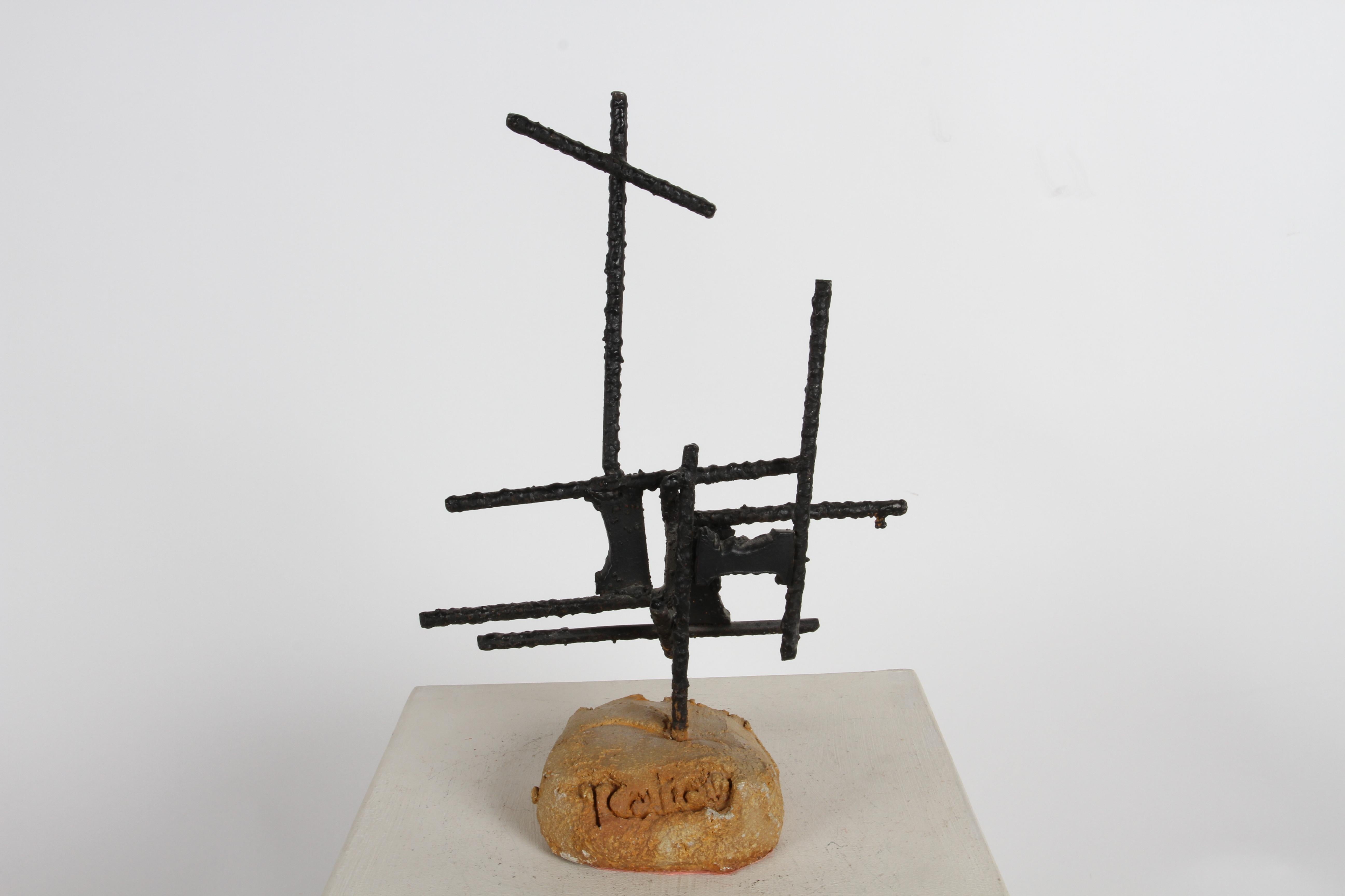 Signed Mid-Century modern Brutalist / abstract sculpture made of welded iron rebar and steel, painted black on colored concrete based. Indiscriminately signed to base. Great coffee table or book shelf sculpture. In the style of Marc Weinstein of