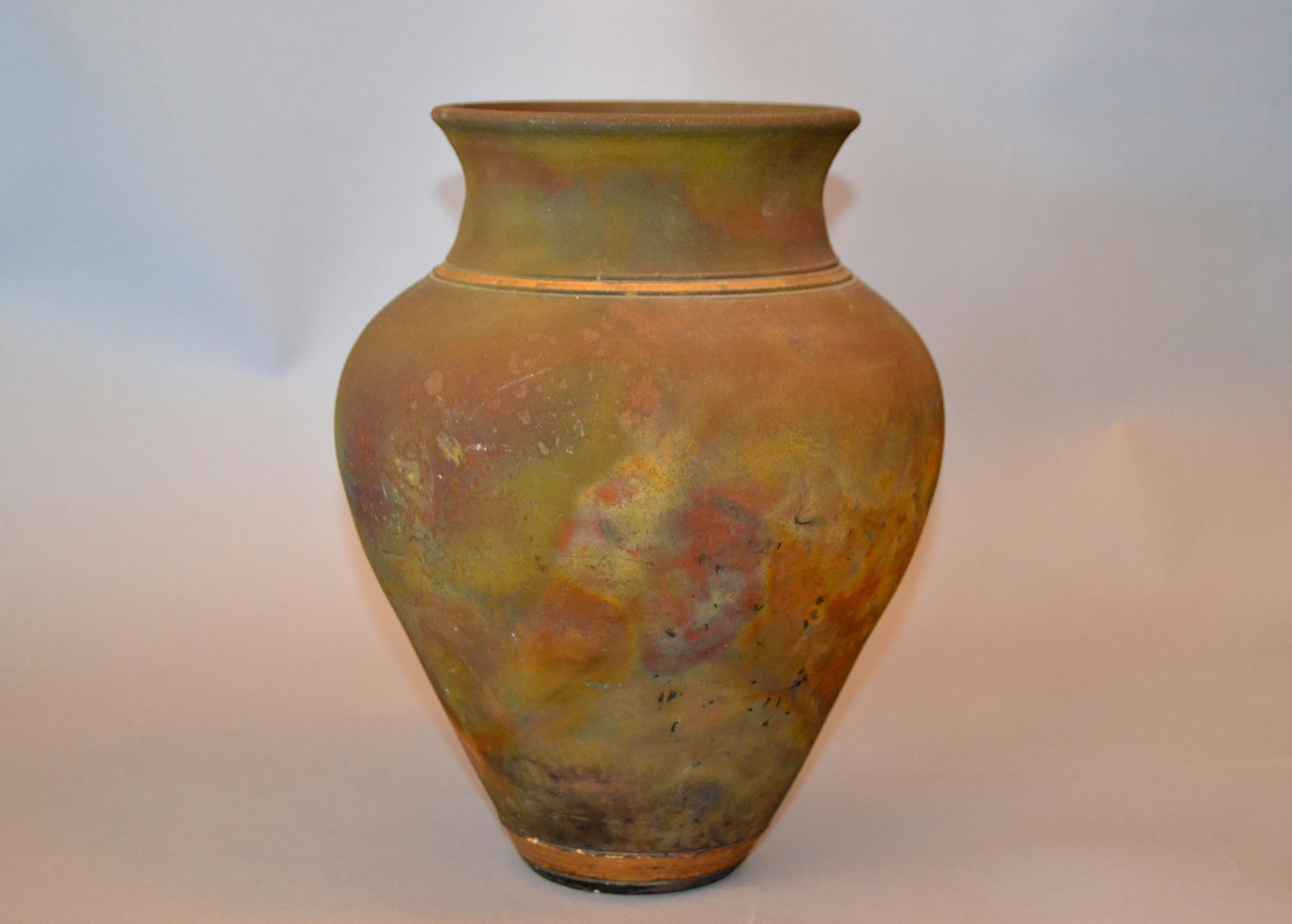 Signed American Raku Mid-Century Modern inside glazed handcrafted beige, blue, gold and brown vase, vessel or urn.
The Studio Art Pottery is signed at the base.
         