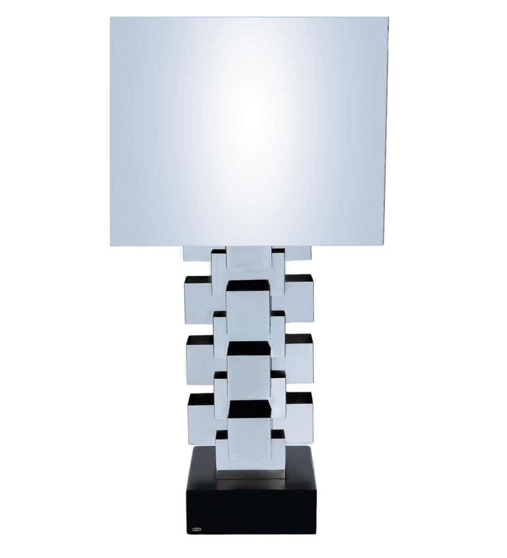 A large skyscraper table lamp designed by Curtis Jere circa 1971.. It features mirror polished chrome construction with slotted stacked base. Very clean, tested & working, ready for immediate use.