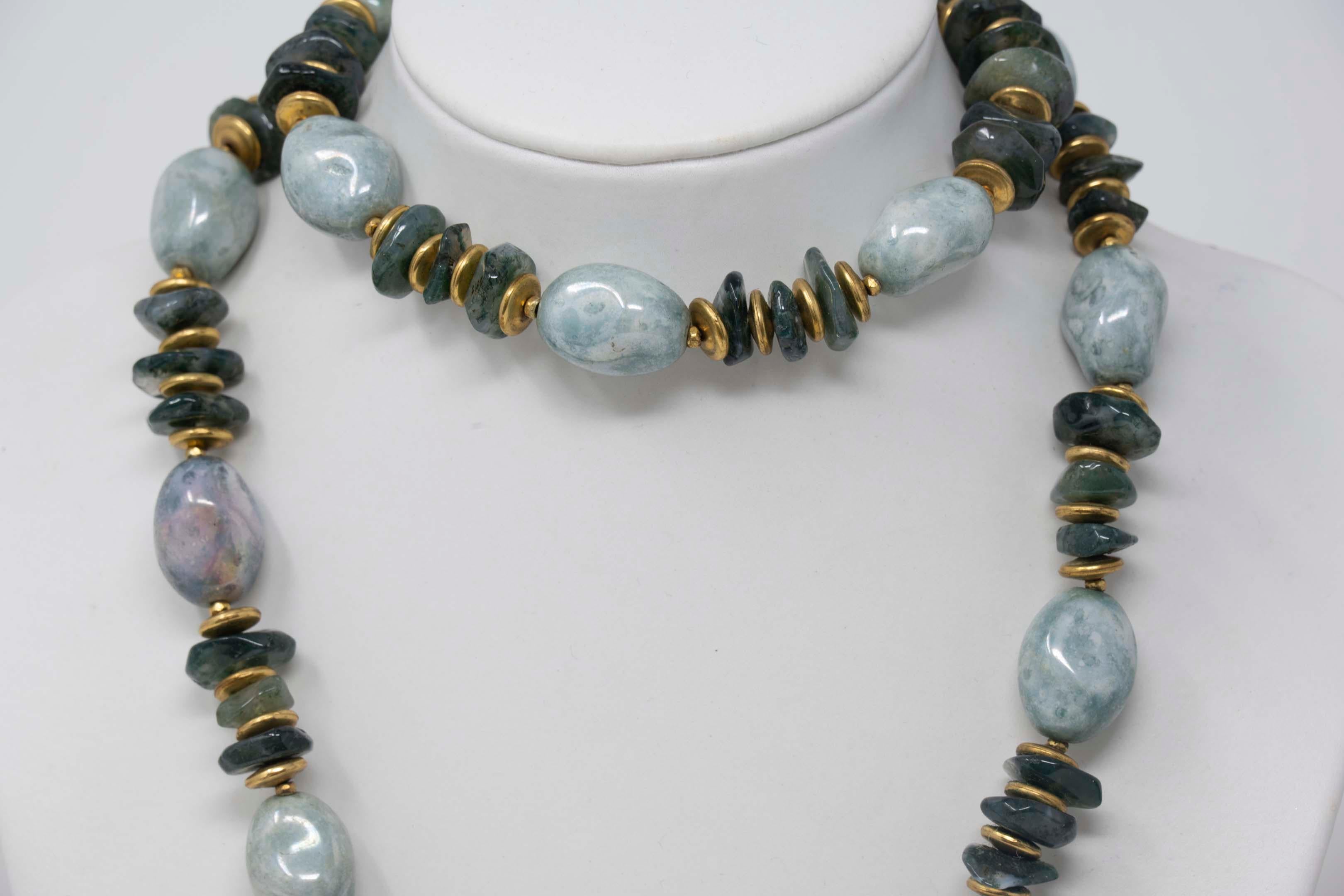 Vintage Miriam Haskell necklace with gilt metal and semi precious stones. The necklace measures 28 inches long x .5 inches in width, Made in USA 1950, In good condition.
