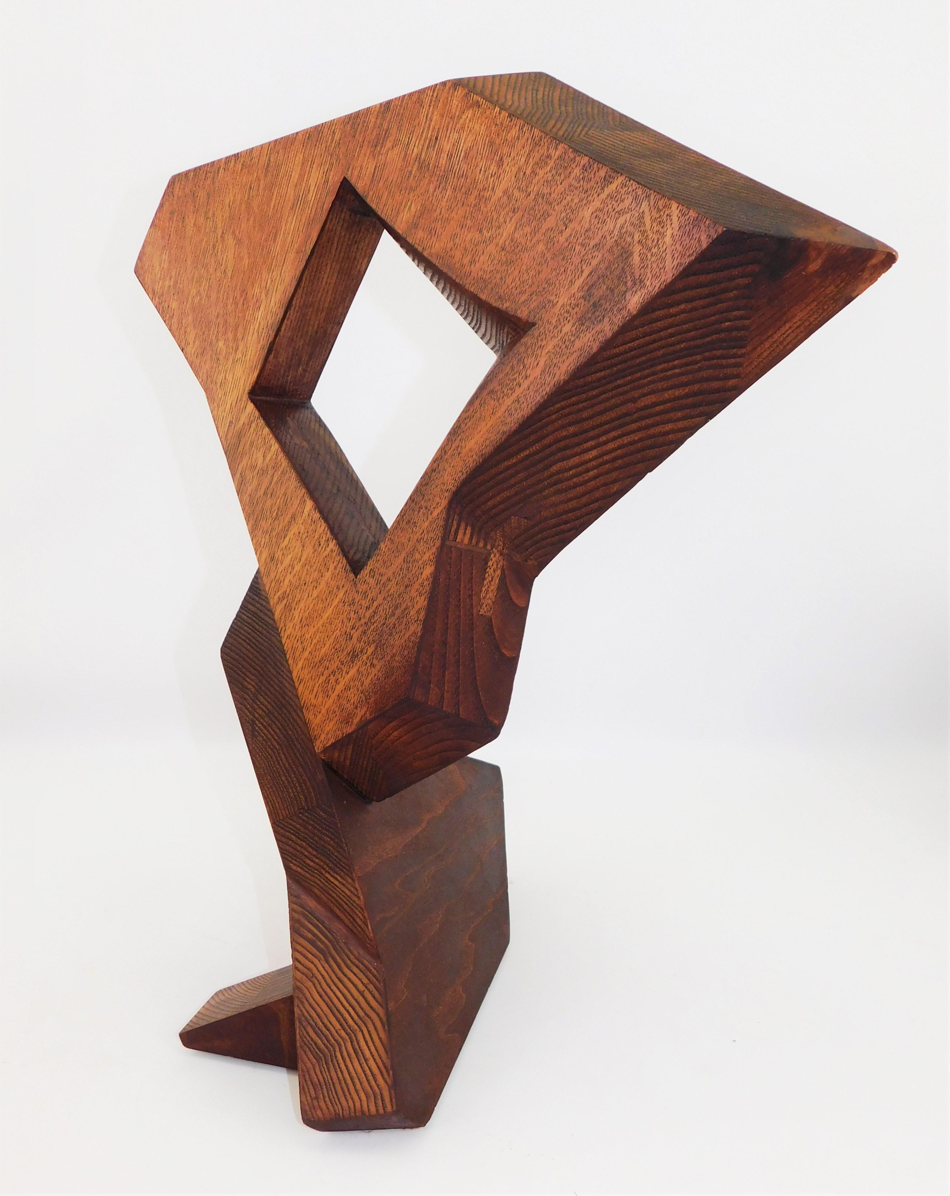 This contemporary abstract wooden sculpture was done by Czeslaw Budny a Polish-Canadian artist in the constructivist style circa 2019. This sculpture was made entirely of up-cycled, reclaimed wood from a variety of sources and utilizes the