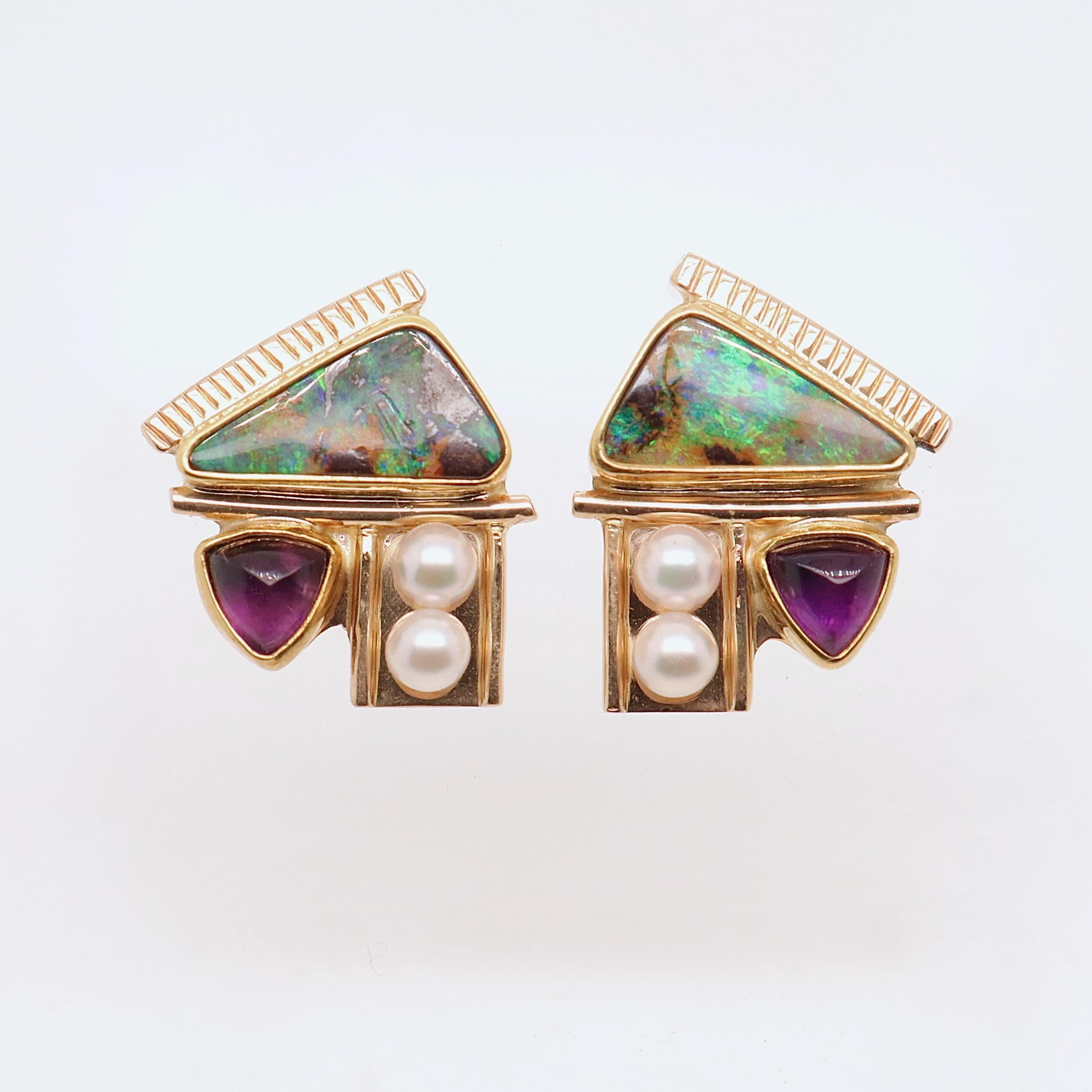 A fine pair of Modernist gold, opal, pearl, and amethyst earrings.

With bezel set triangular opal cabochons, sugarloaf amethyst cabochons, and small near round white pearls. 

Set in benchmade Modernist settings in 14K & 22K yellow golds.

Each