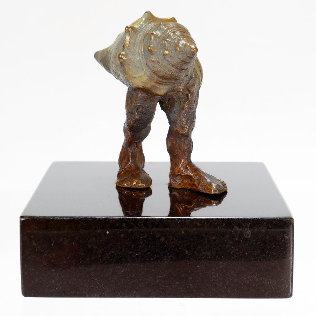 Signed Modernist Surreal Bronze Sculpture of a Walking Conch Shell with Leg In Good Condition For Sale In Philadelphia, PA